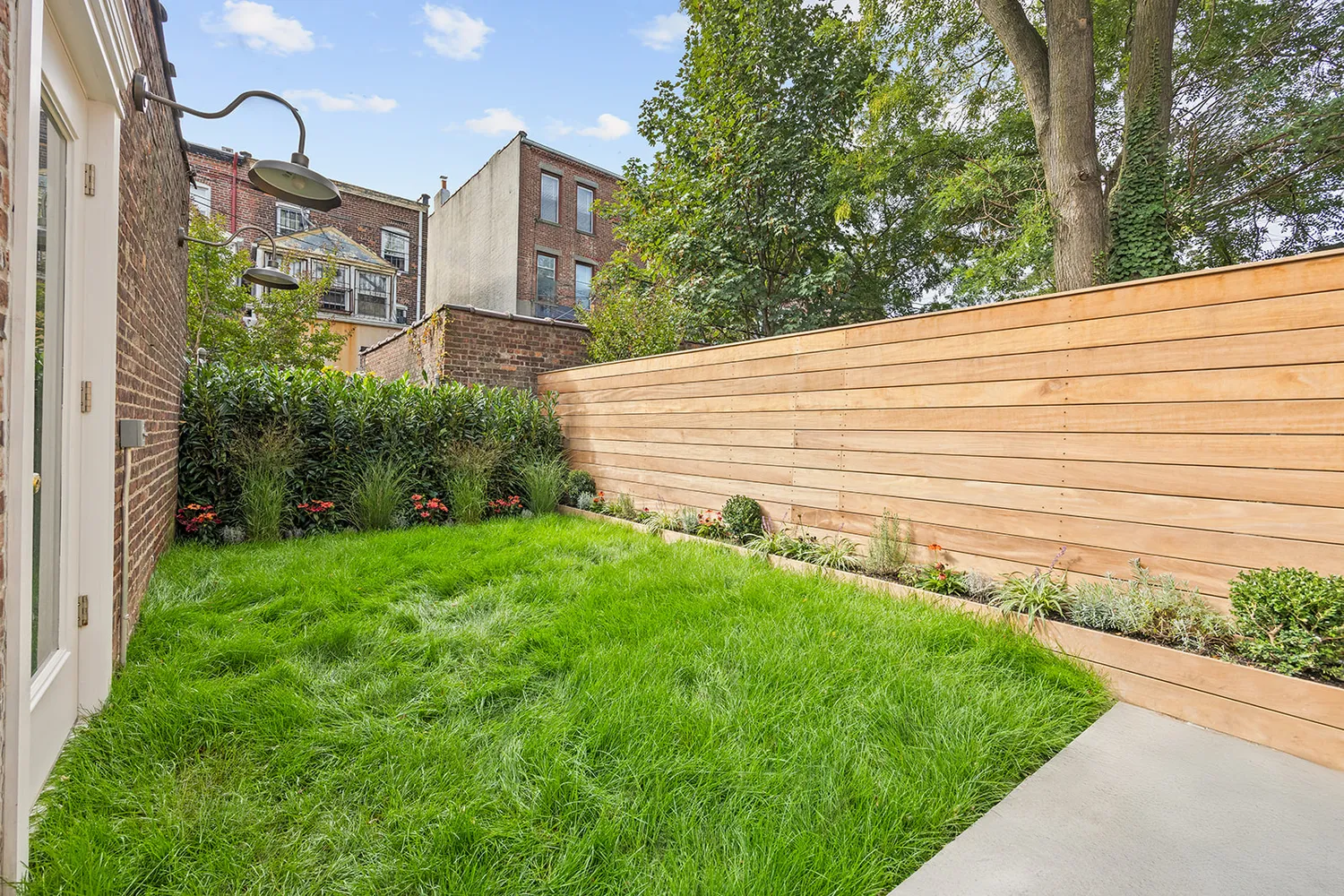a view of balcony with small garden