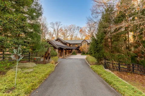 a view of a pathway of a house with a yard