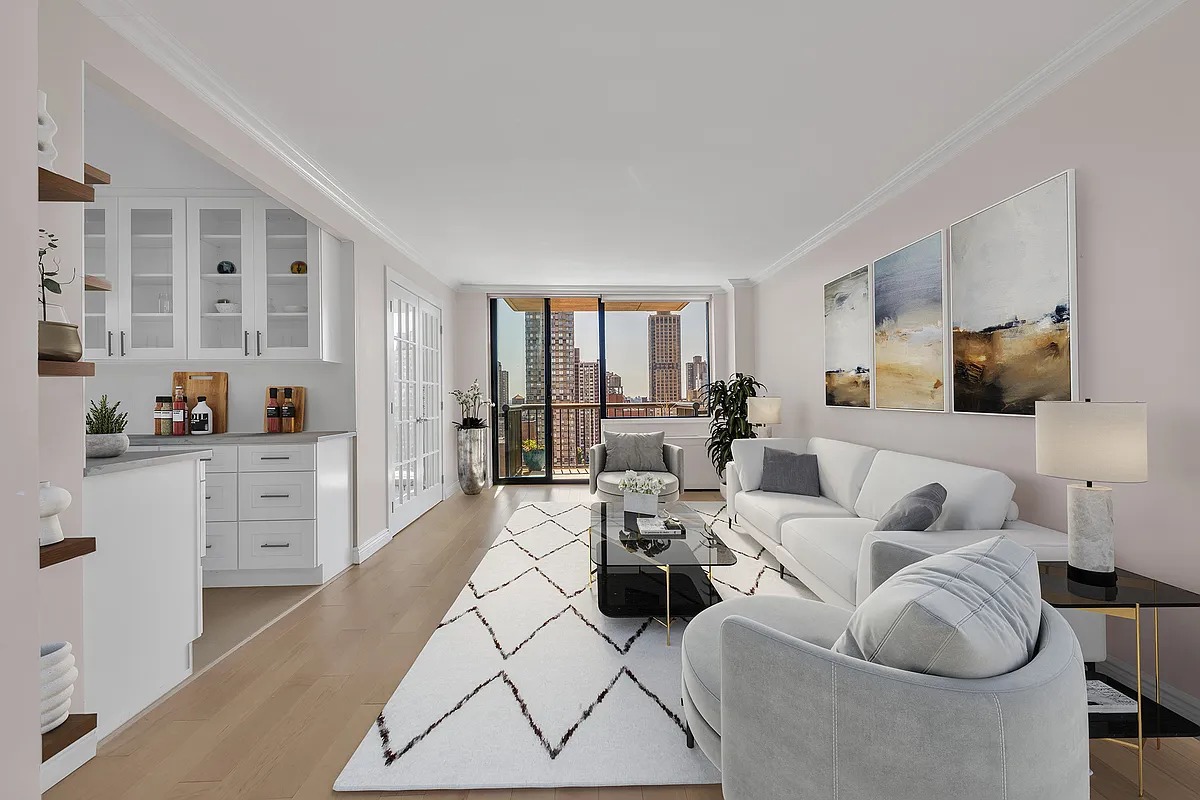 171 East 84th Street, Unit 22C Manhattan, NY 10028 - Photo 2 of 17 a living room with furniture a large window and kitchen view