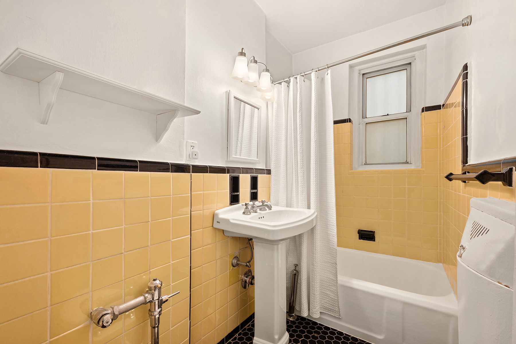 55 Eastern Parkway, Unit 1D Brooklyn, NY 11238 - Photo 7 of 8 a bathroom with a sink a bathtub and shower