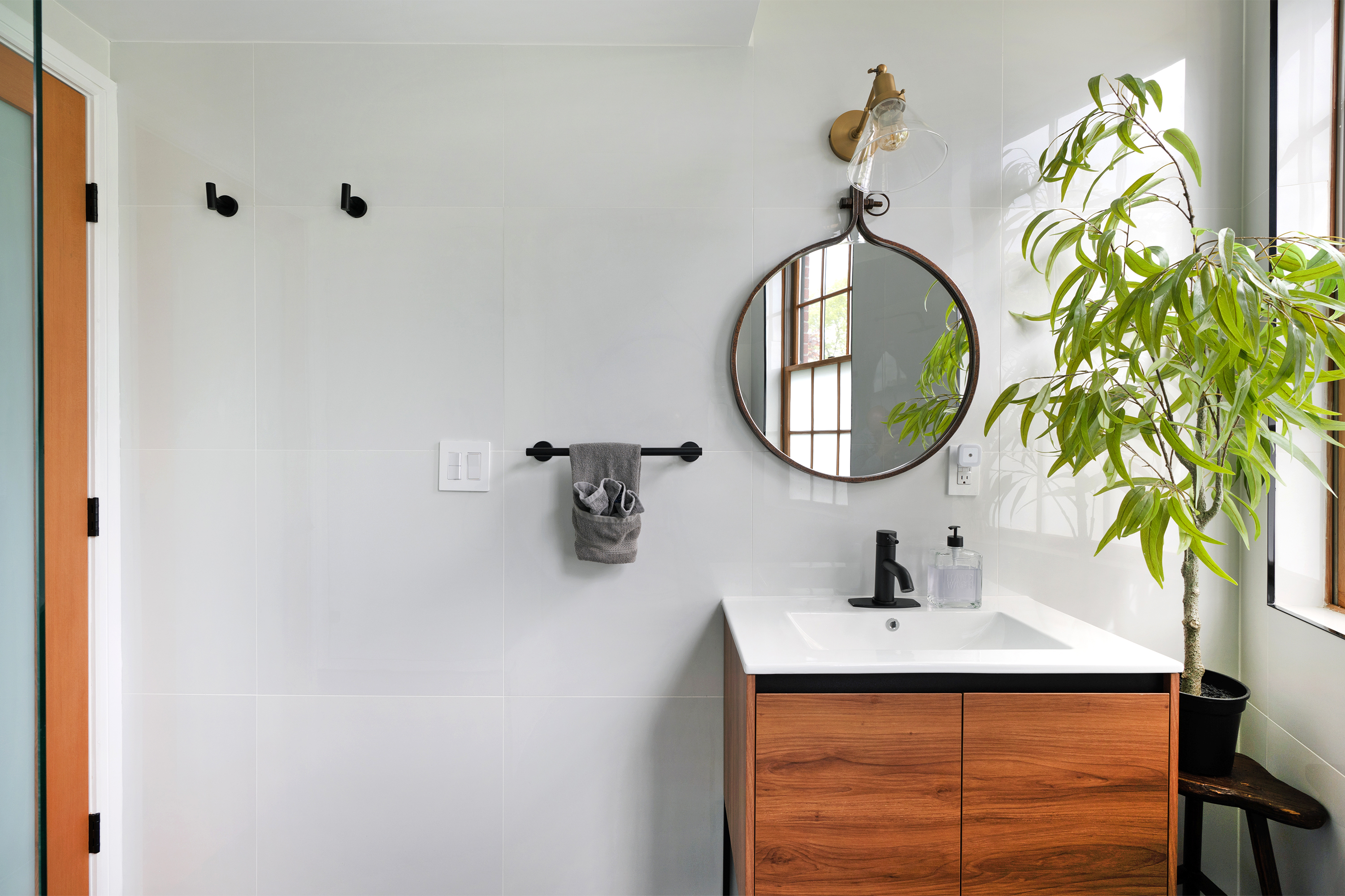 334 Plymouth Street Brooklyn, NY 11201 - Photo 11 of 32 a bathroom with a sink and a mirror