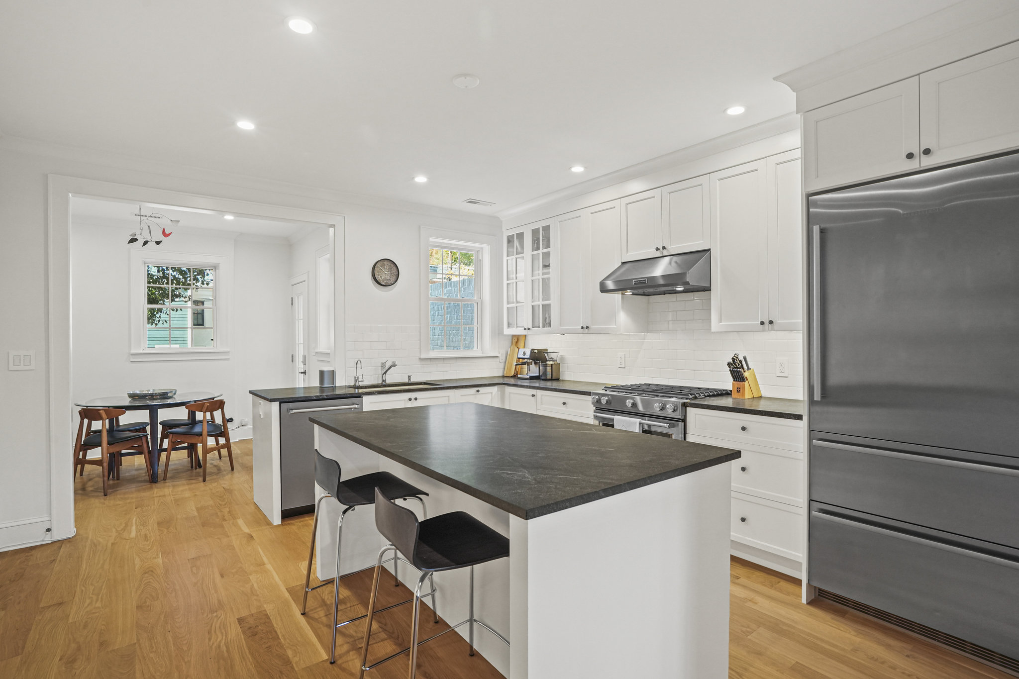 1920 35th Street Northwest Washington, DC 20007 - Photo 2 of 54 a kitchen with stainless steel appliances granite countertop a sink a stove and a refrigerator