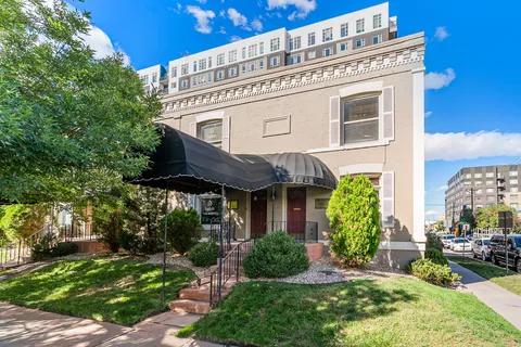 a front view of a building with garden