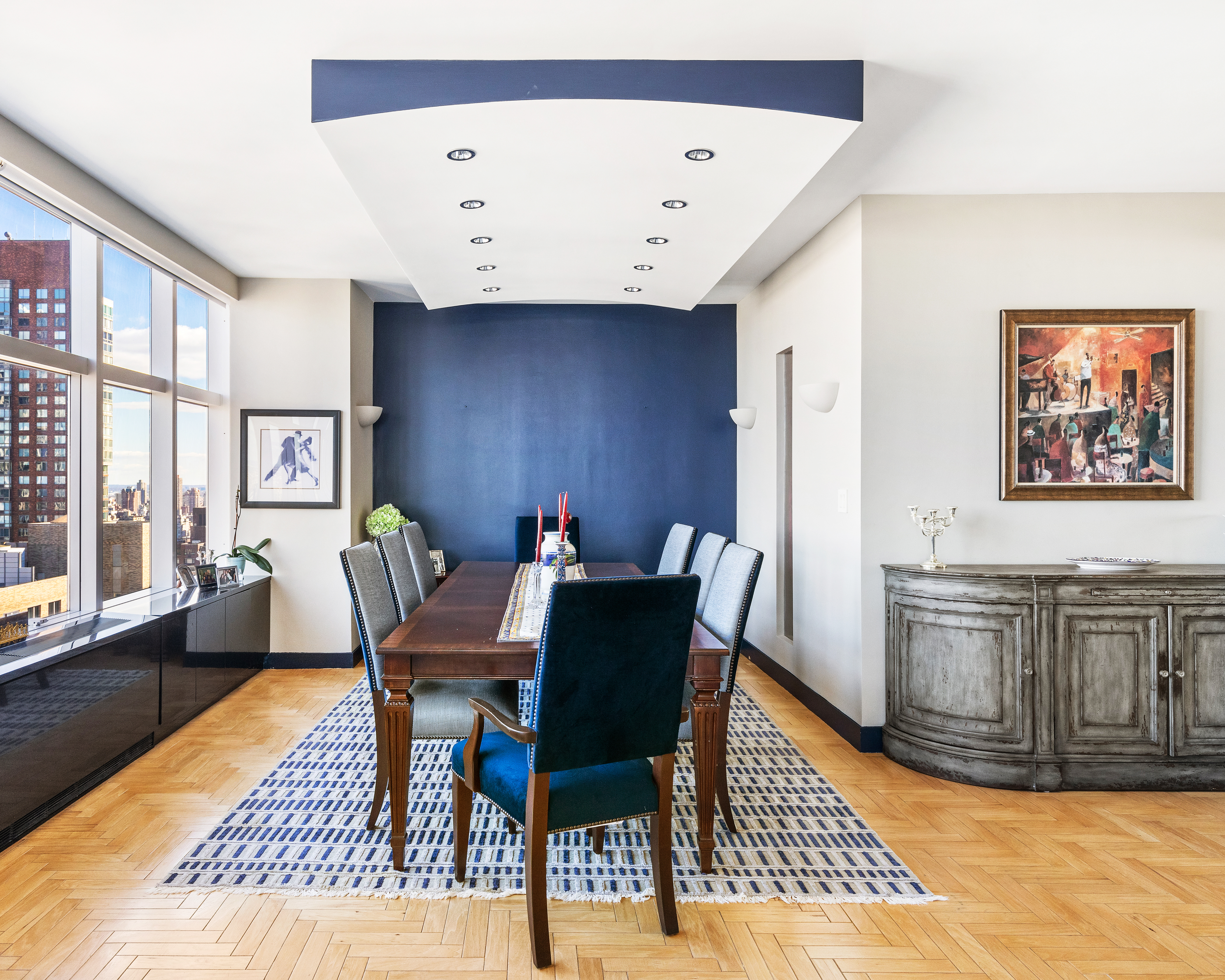 160 West 66th Street, Unit 42AB Manhattan, NY 10023 - Photo 5 of 15 a view of a dining room with furniture and wooden floor