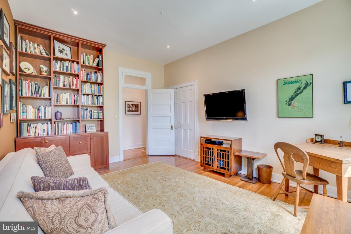 2415 20th Street Northwest, Unit 38 Washington, DC 20009 - Photo 22 of 30 a living room with furniture and a flat screen tv
