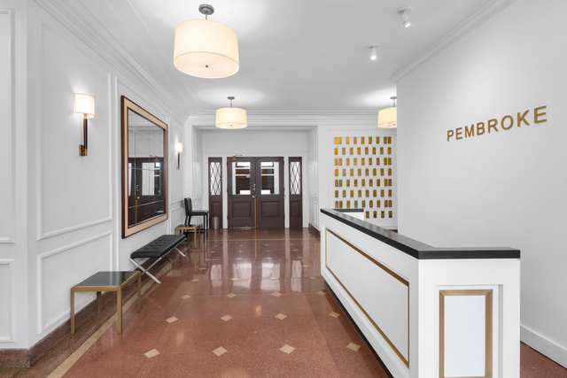 357 West 55th Street, Unit 4D Manhattan, NY 10019 - Photo 9 of 11 a hallway with a large mirror and furniture