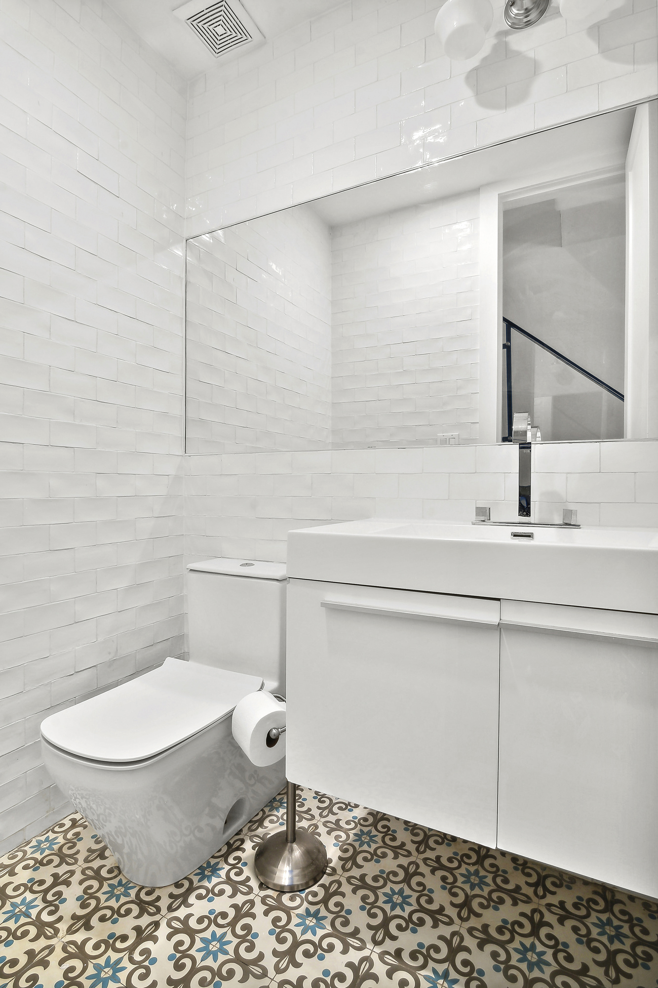 449 Evergreen Avenue, Unit 1 Brooklyn, NY 11221 - Photo 8 of 10 a bathroom with a toilet a sink and mirror