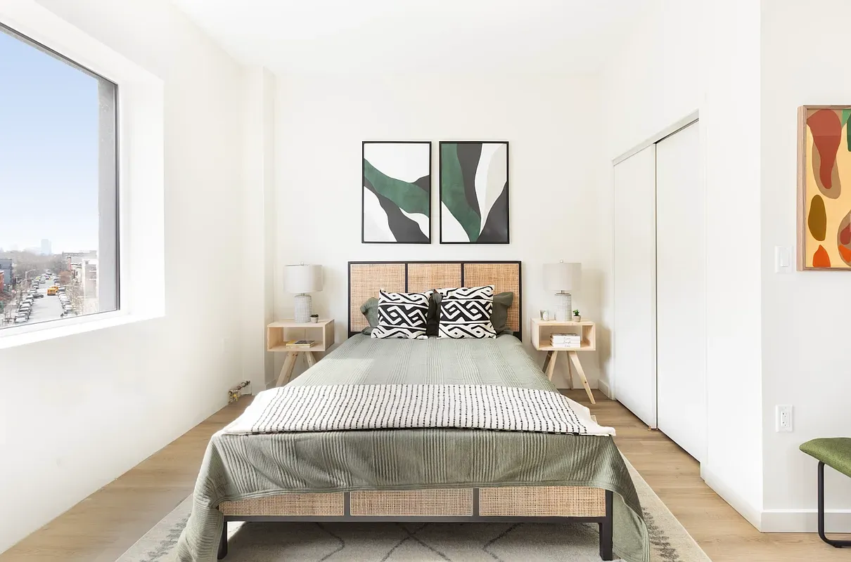 a bedroom with a bed and window