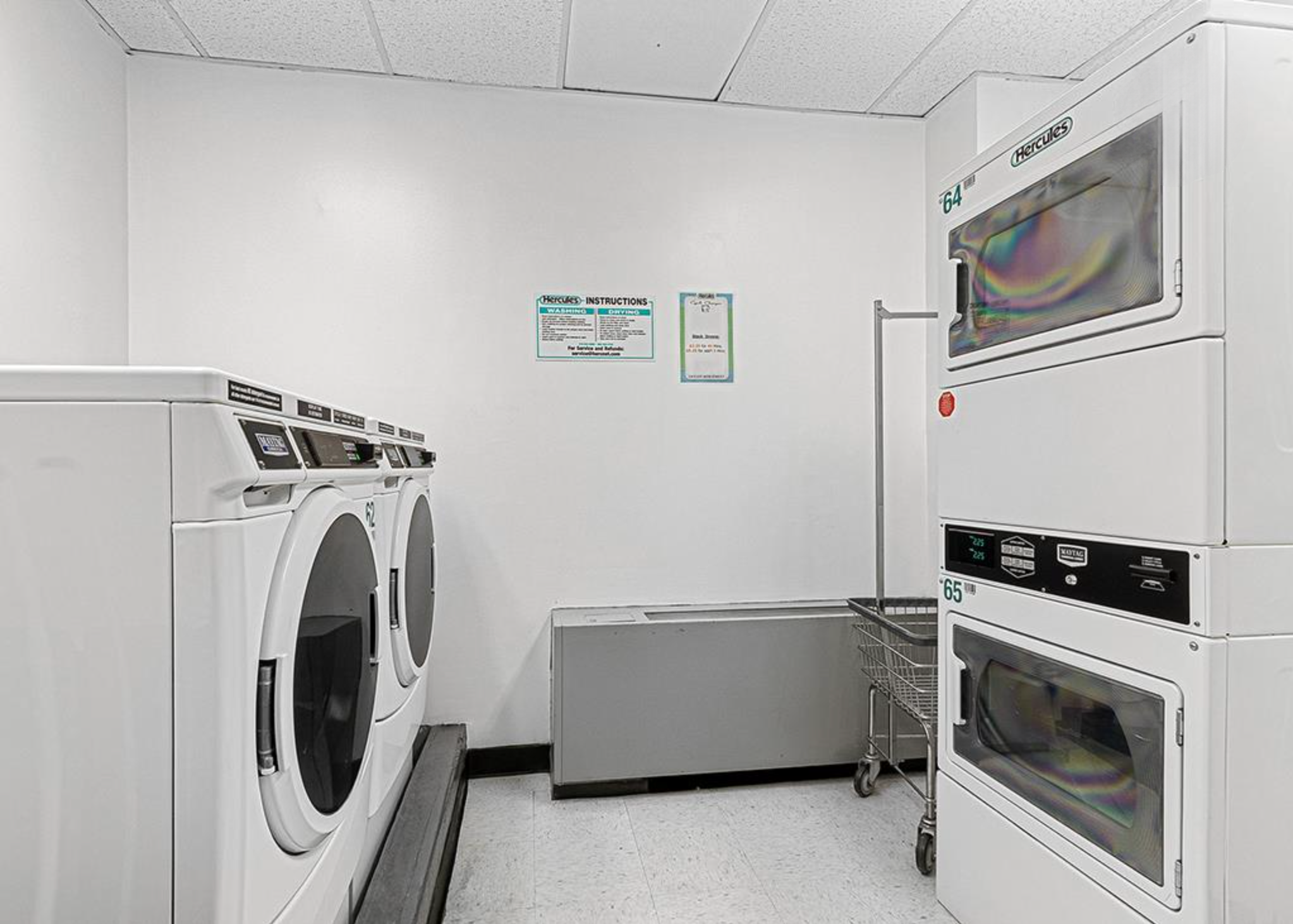 310 East 46th Street, Unit 19F Manhattan, NY 10017 - Photo 14 of 17 a utility room with dryer and washer