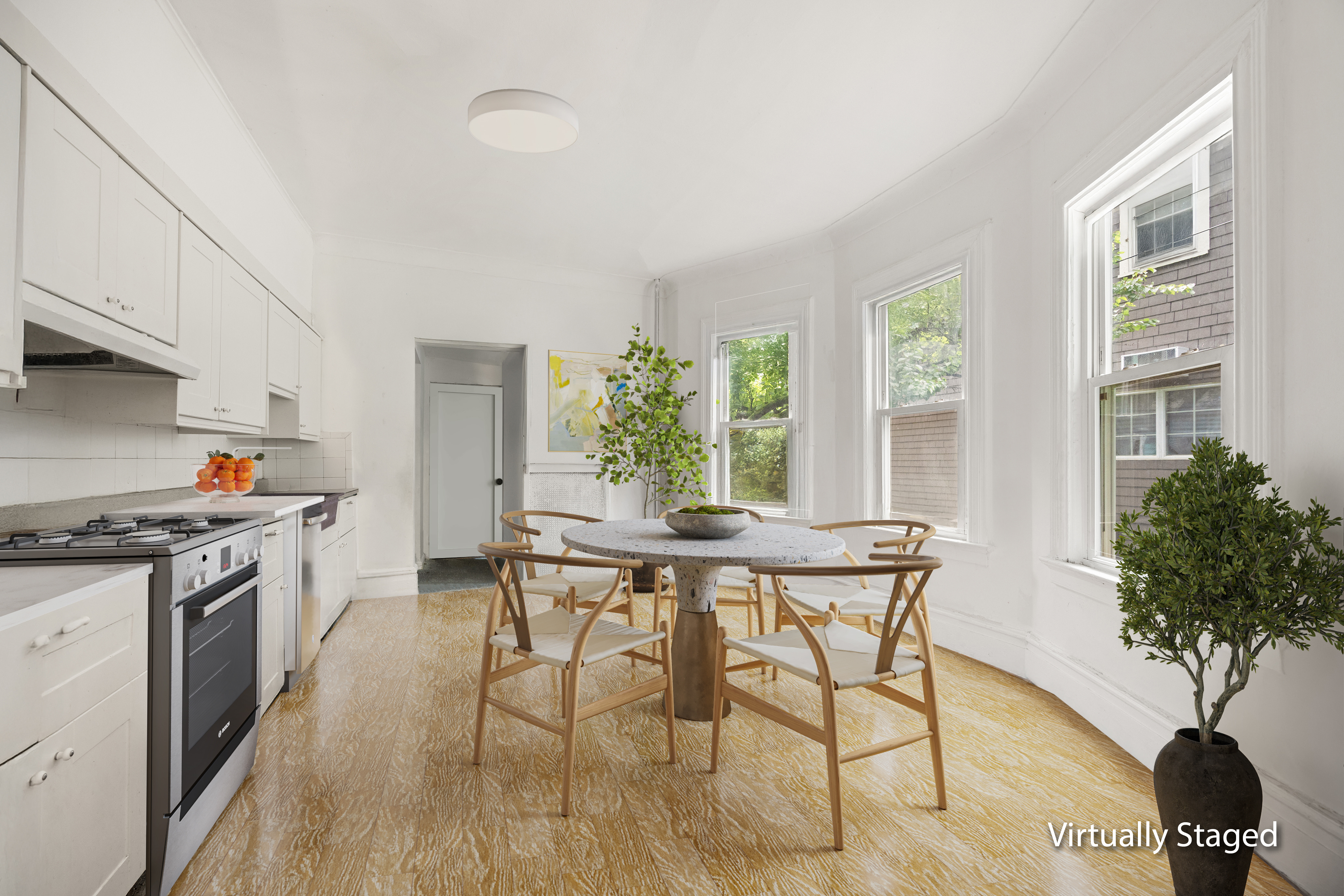 215 Stratford Road, Unit 1 Brooklyn, NY 11218 - Photo 2 of 9 a view of a kitchen with a table and chairs in it