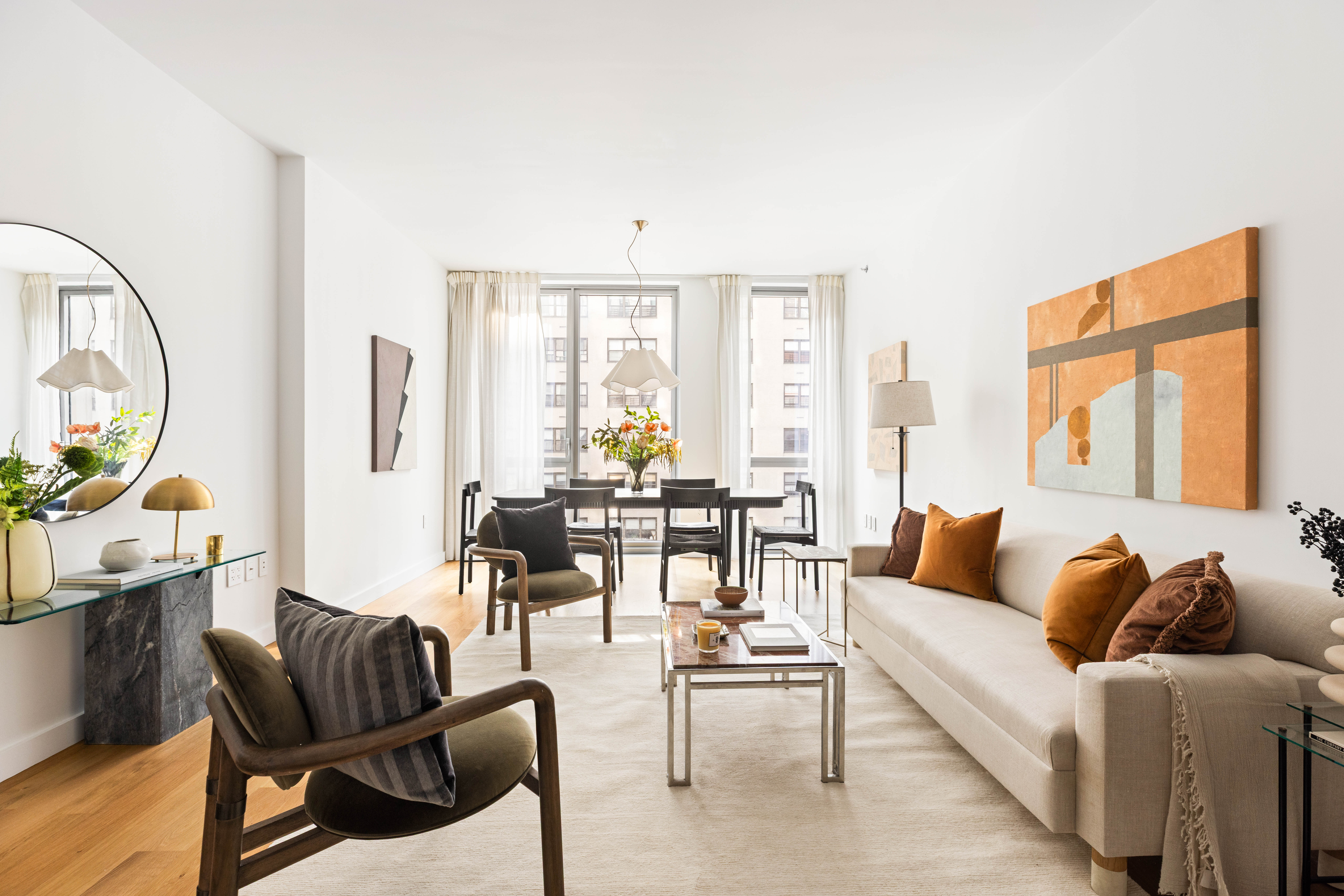 360 East 89th Street, Unit 5D Manhattan, NY 10128 - Photo 3 of 13 a living room with furniture and a large window