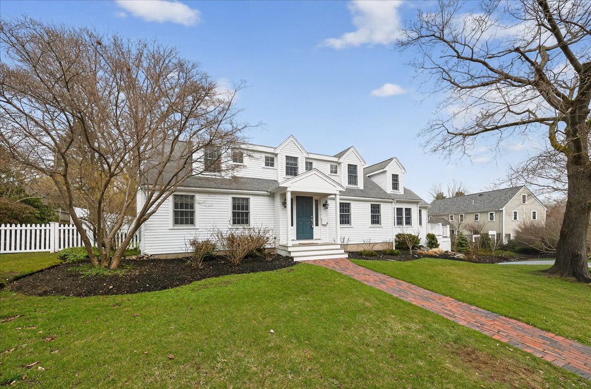 6 Studley Road Hingham, MA 02043 - Photo 3 of 27 a front view of a house with a garden and trees