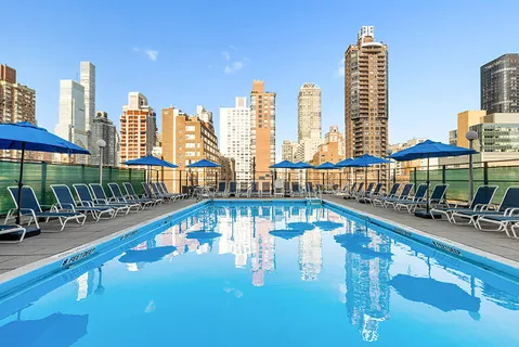 a view of swimming pool with outdoor seating