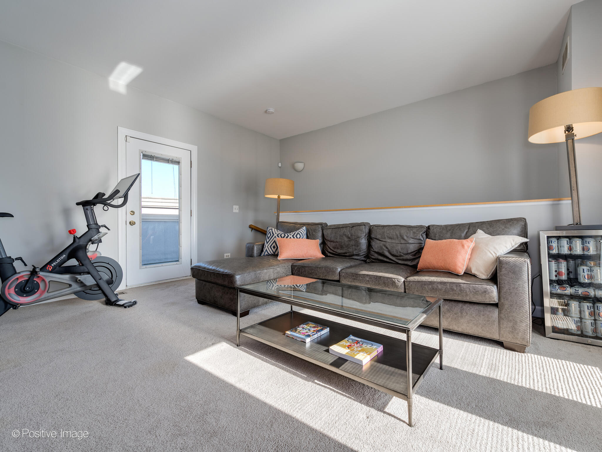 855 North May Street, Unit G Chicago, IL 60642 - Photo 23 of 28 a living room with furniture a rug and a lamp