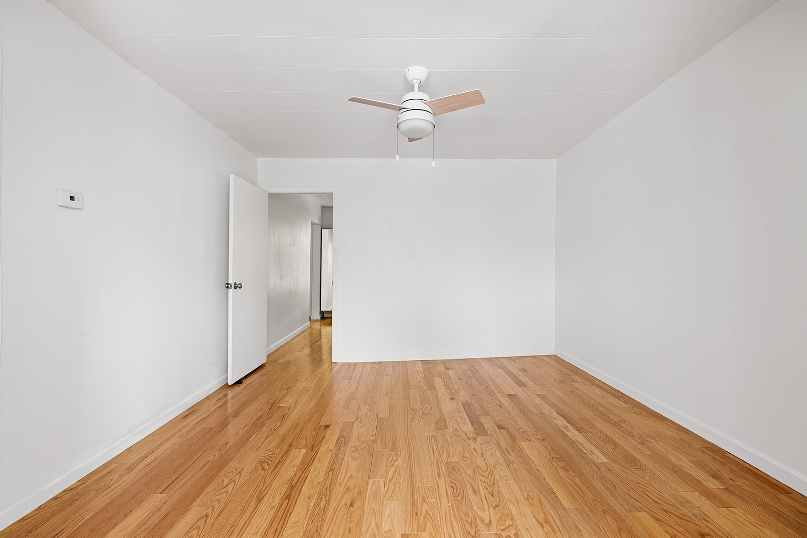 44 1st Street, Unit 2 Brooklyn, NY 11231 - Photo 6 of 6 a view of room with wooden floor ceiling fan and window