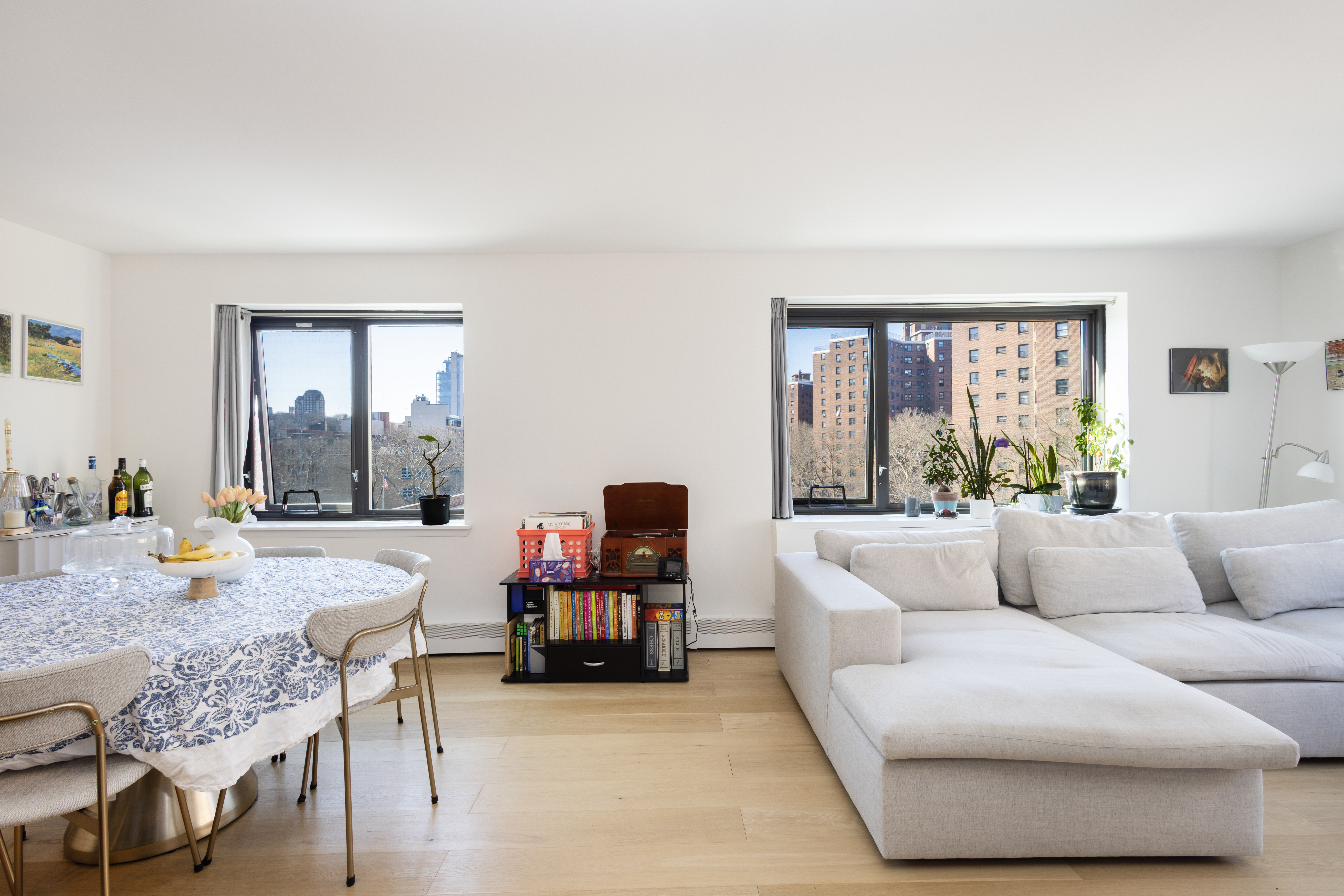 1330 5th Avenue, Unit 6C Manhattan, NY 10026 - Photo 3 of 16 a living room with furniture and a window