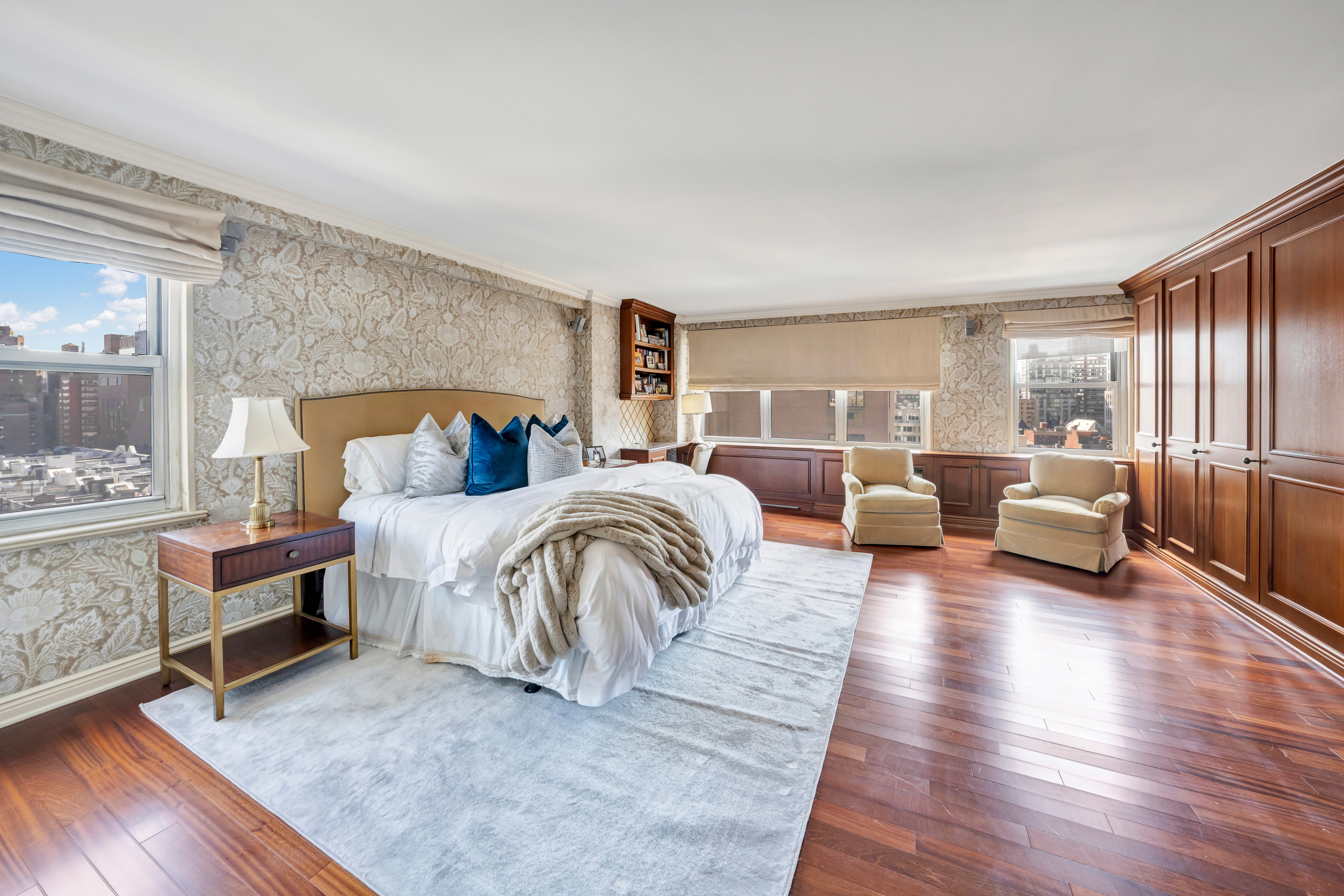 444 East 84th Street, Unit PHE Manhattan, NY 10028 - Photo 6 of 12 a bedroom with furniture and a wooden floor