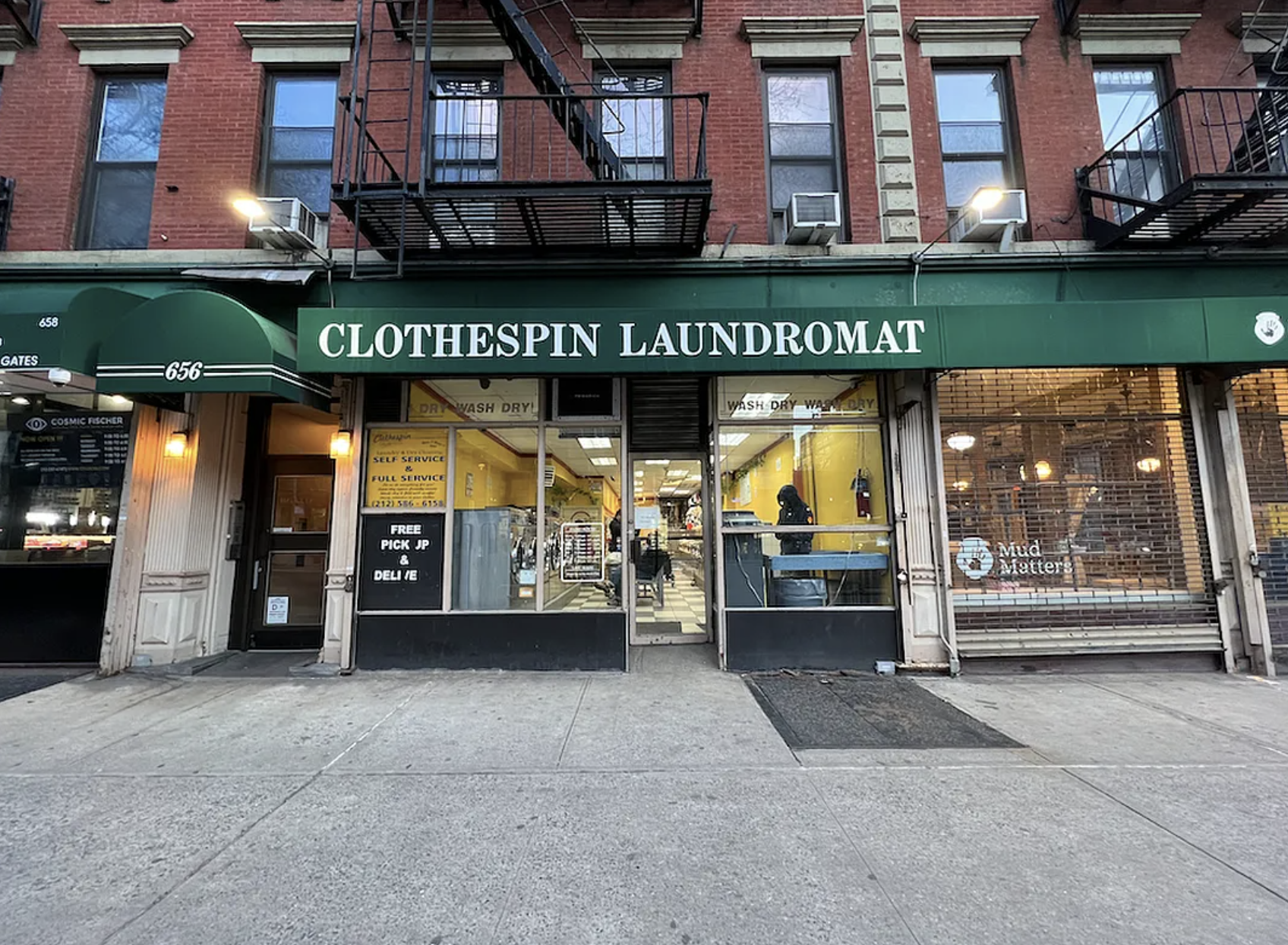 446 West 46th Street, Unit 12 Manhattan, NY 10036 - Photo 15 of 18 a view of a building with car parked