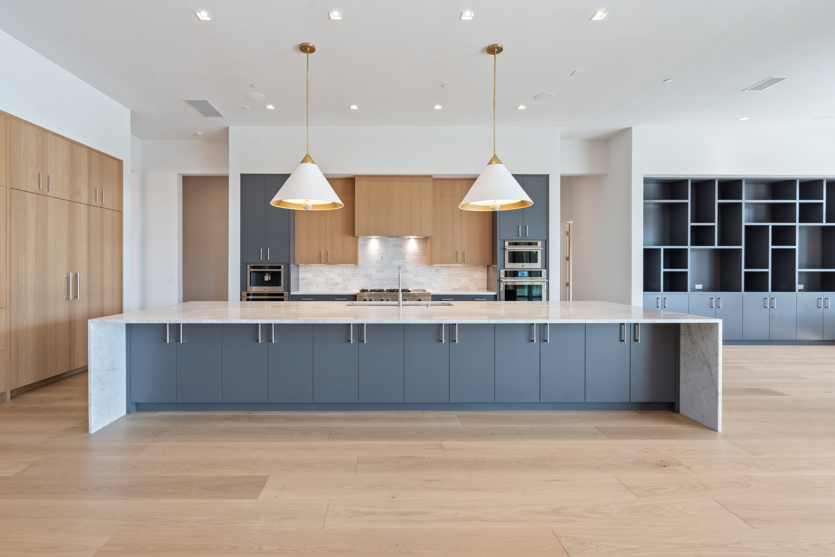1905 Hallam Drive Austin, TX 78746 - Photo 11 of 39 an open kitchen with wooden floor and window