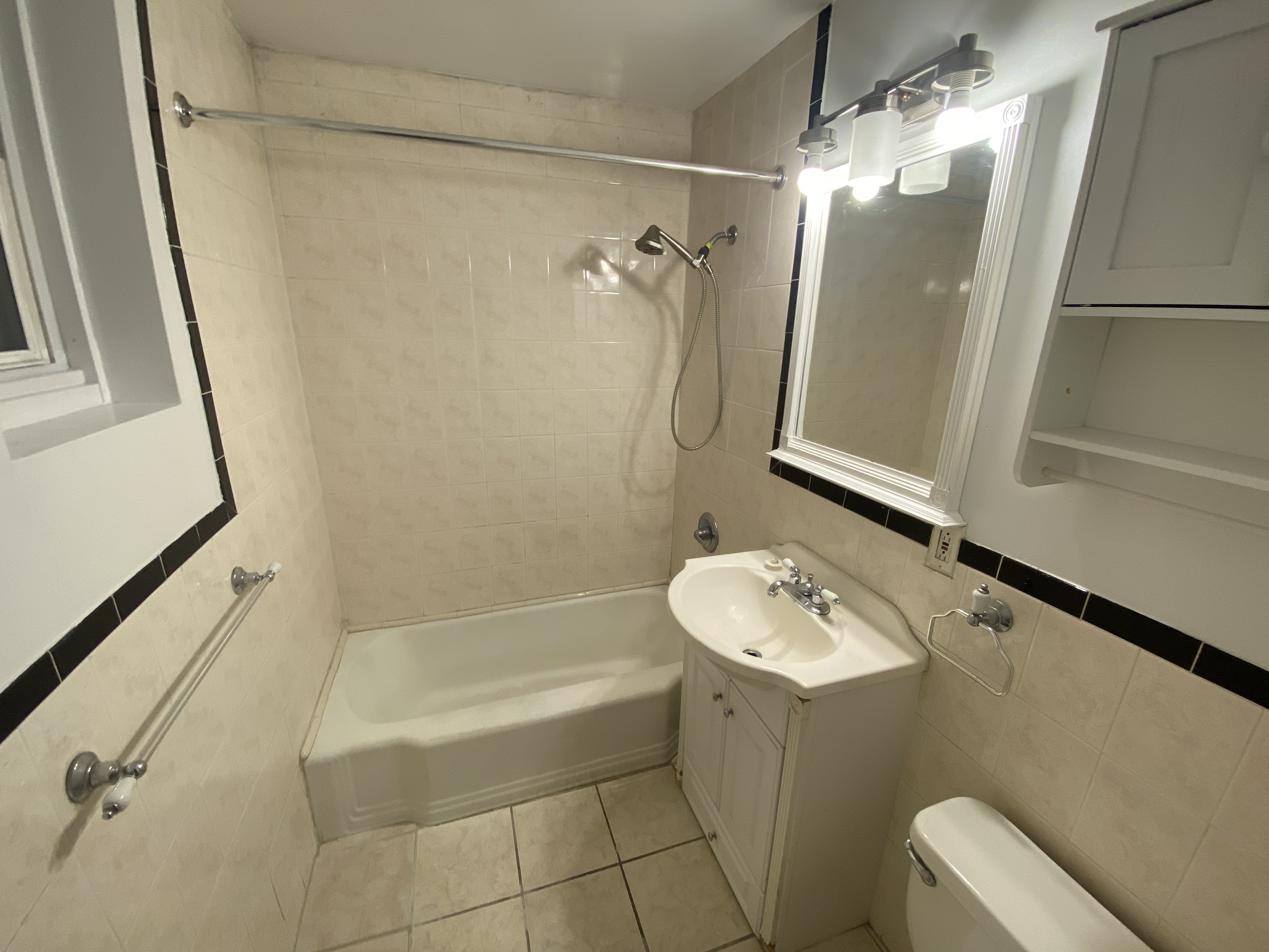 117 East 35th Street, Unit 1 Manhattan, NY 10016 - Photo 5 of 5 a bathroom with a sink a toilet and shower