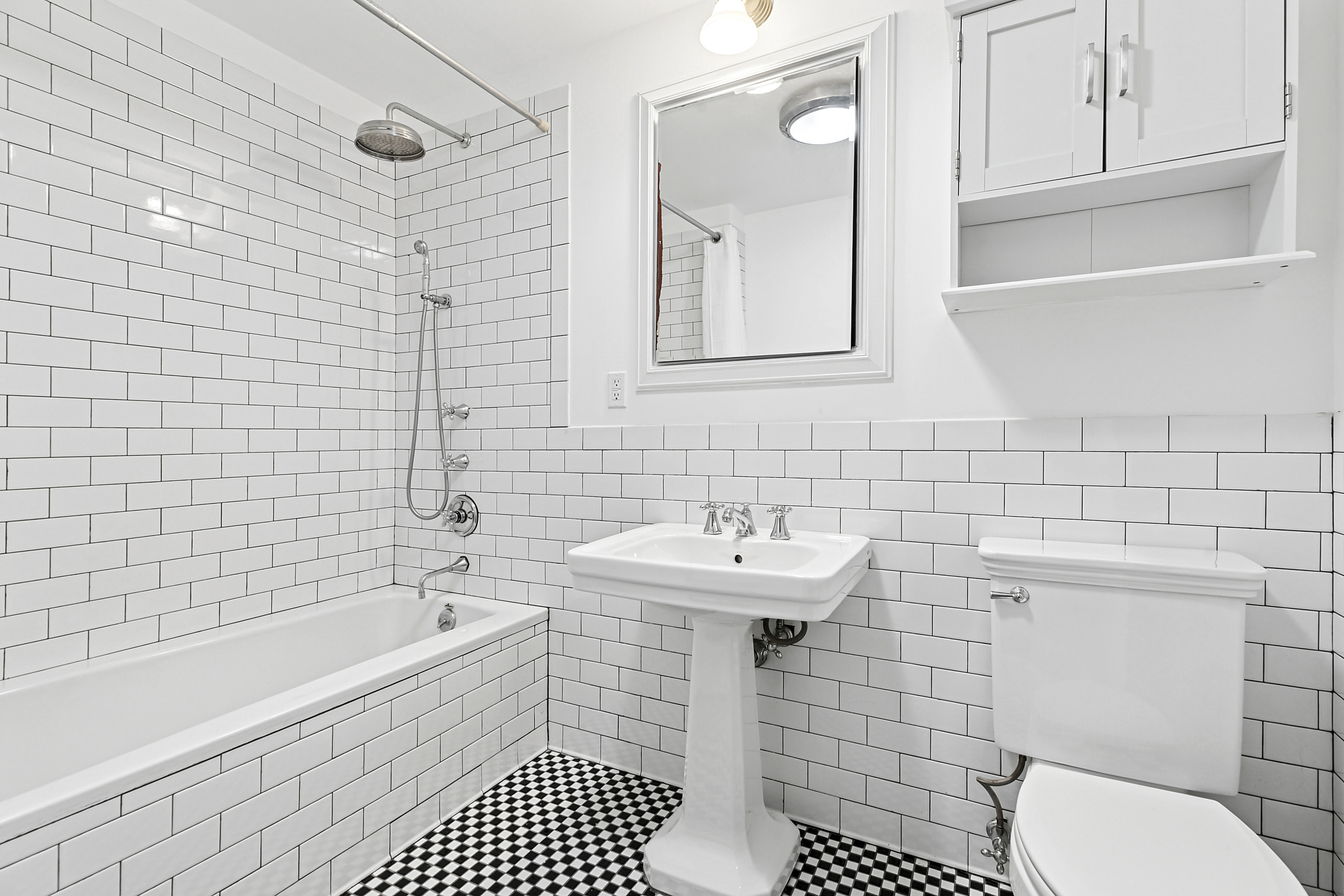 28 Laight Street, Unit 3B Manhattan, NY 10013 - Photo 7 of 11 a bathroom with a sink a toilet and shower