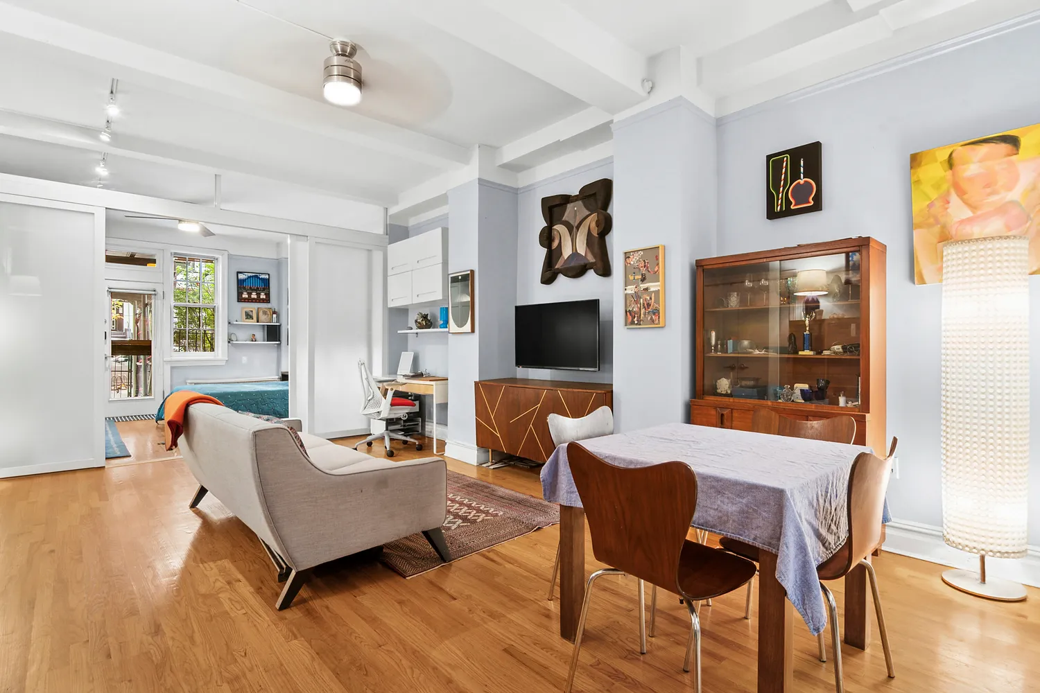 a living room with furniture and a flat screen tv