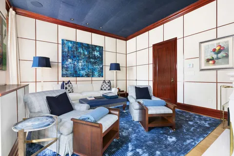 a living room with furniture and a rug