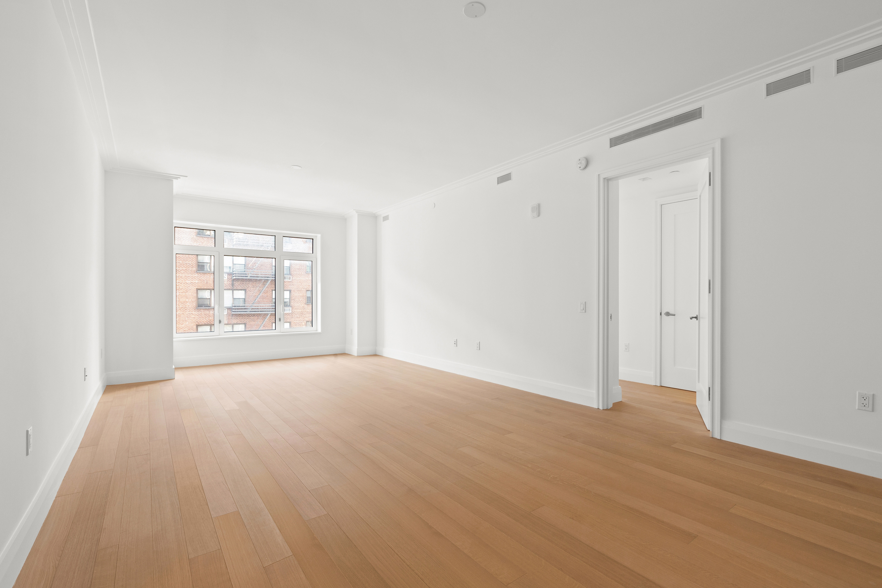 200 East 83rd Street, Unit 5D Manhattan, NY 10028 - Photo 14 of 29 a view of an empty room with a window