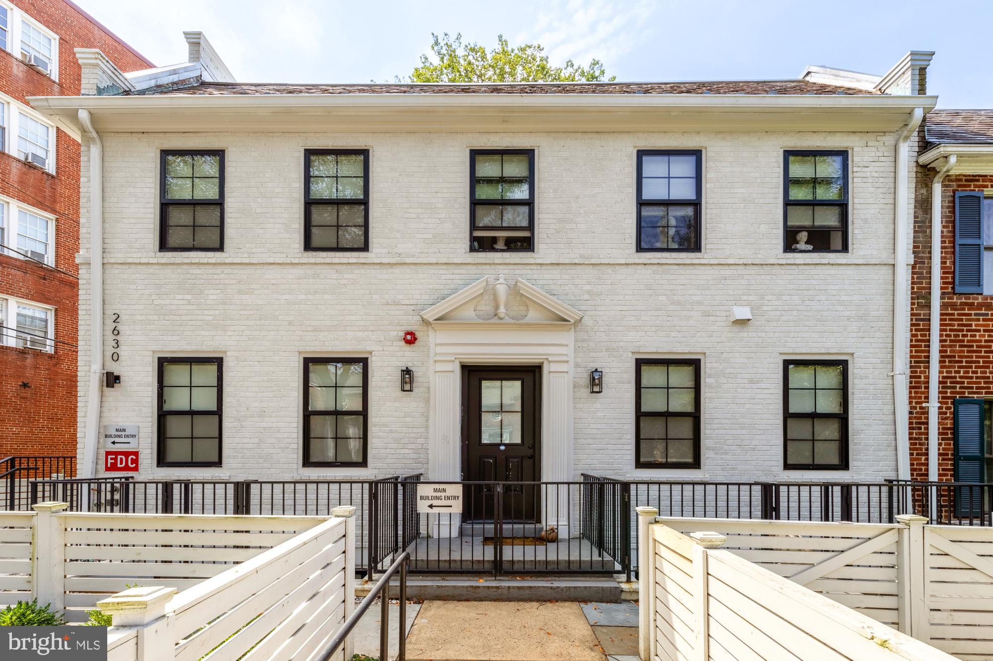2630 39th Street Northwest, Unit 1 Washington, DC 20007 - Photo 2 of 26 a front view of a house with a large window
