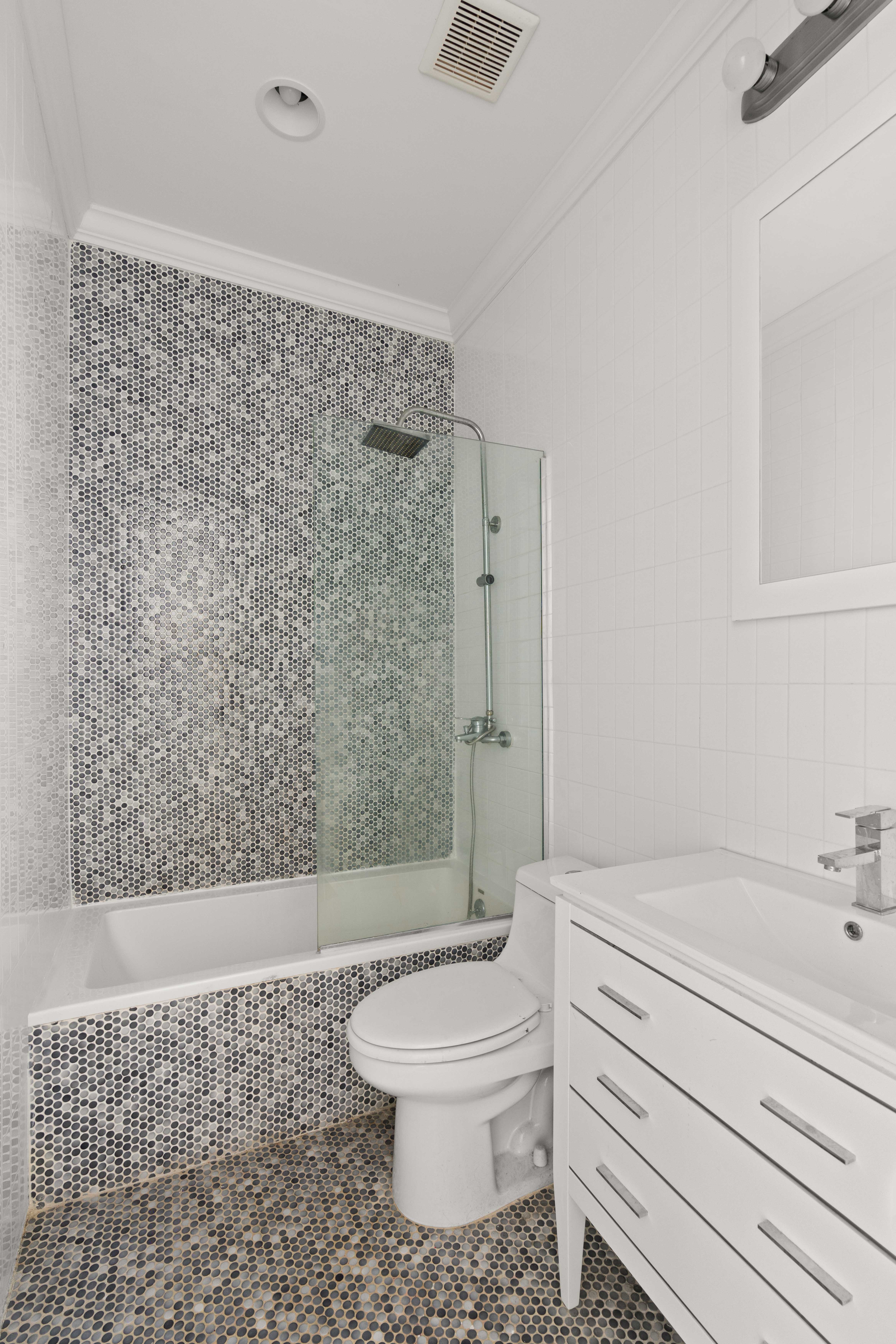 748 Madison Street, Unit 1 Brooklyn, NY 11221 - Photo 7 of 10 a bathroom with a toilet a sink and shower