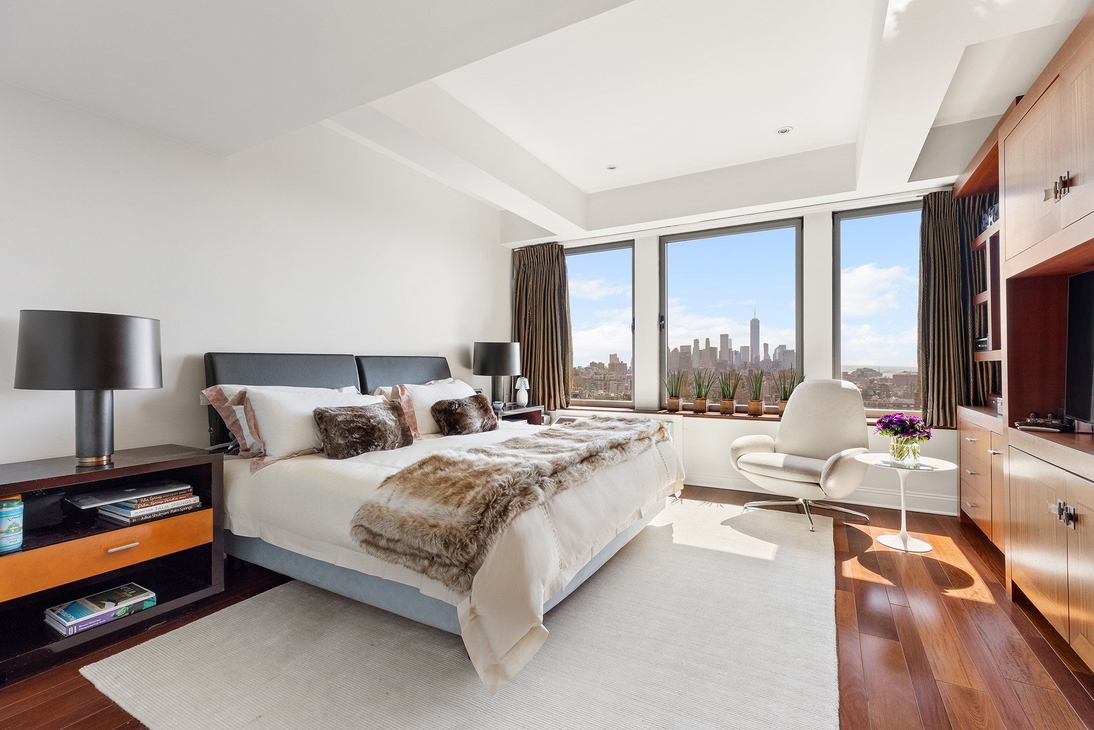 252 7th Avenue, Unit PHG Manhattan, NY 10001 - Photo 18 of 27 a bedroom with a bed and large windows