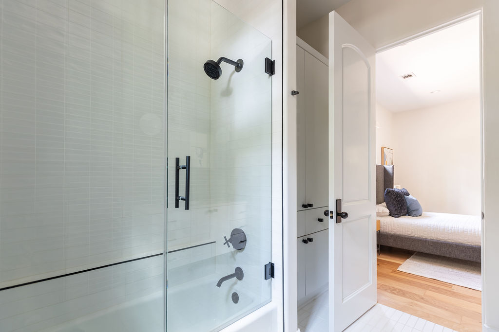 400 Inwood Road Austin, TX 78746 - Photo 39 of 43 a bathroom with a bathtub and a shower