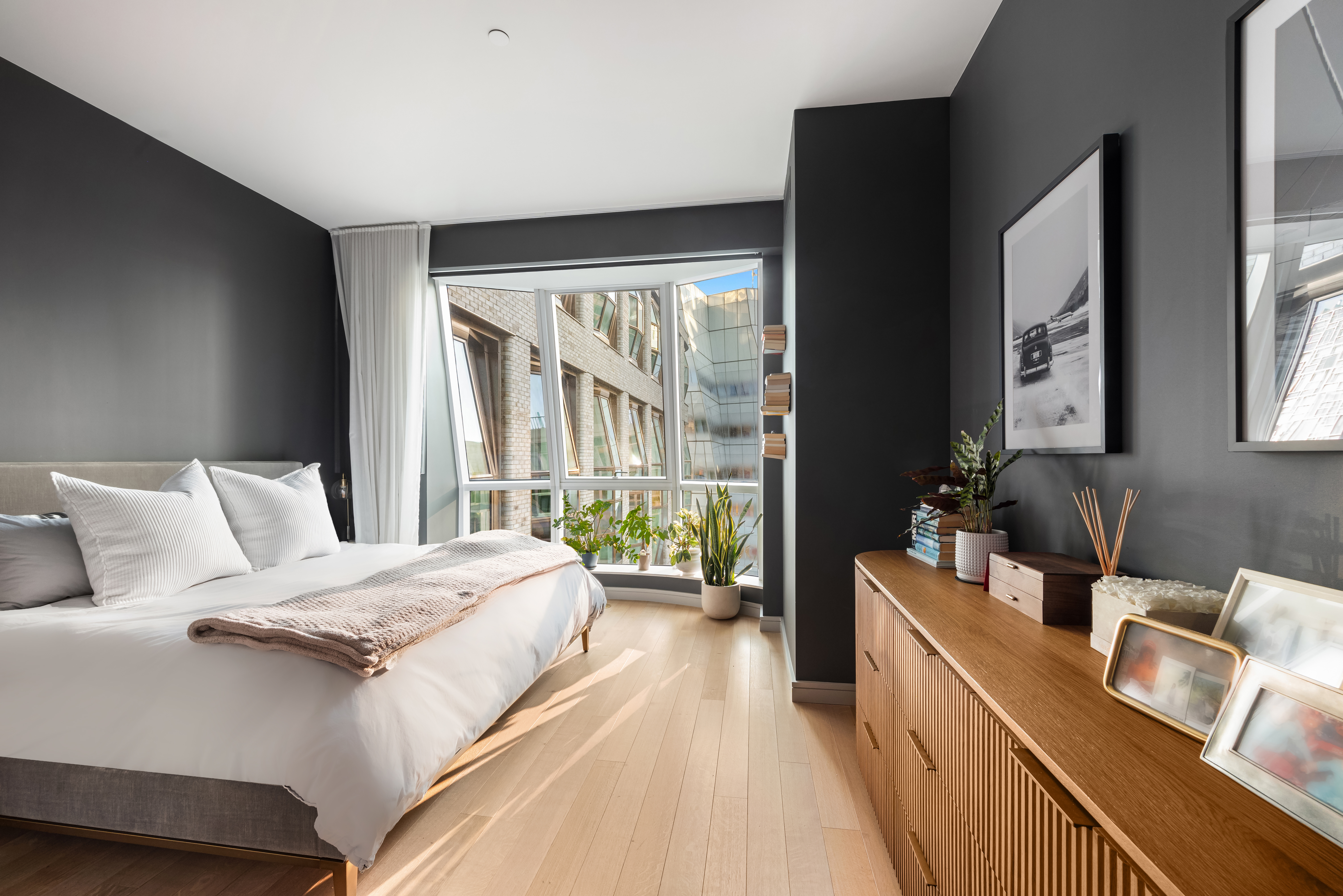 515 West 18th Street, Unit 901 Manhattan, NY 10011 - Photo 6 of 14 a spacious bedroom with a bed and a large window