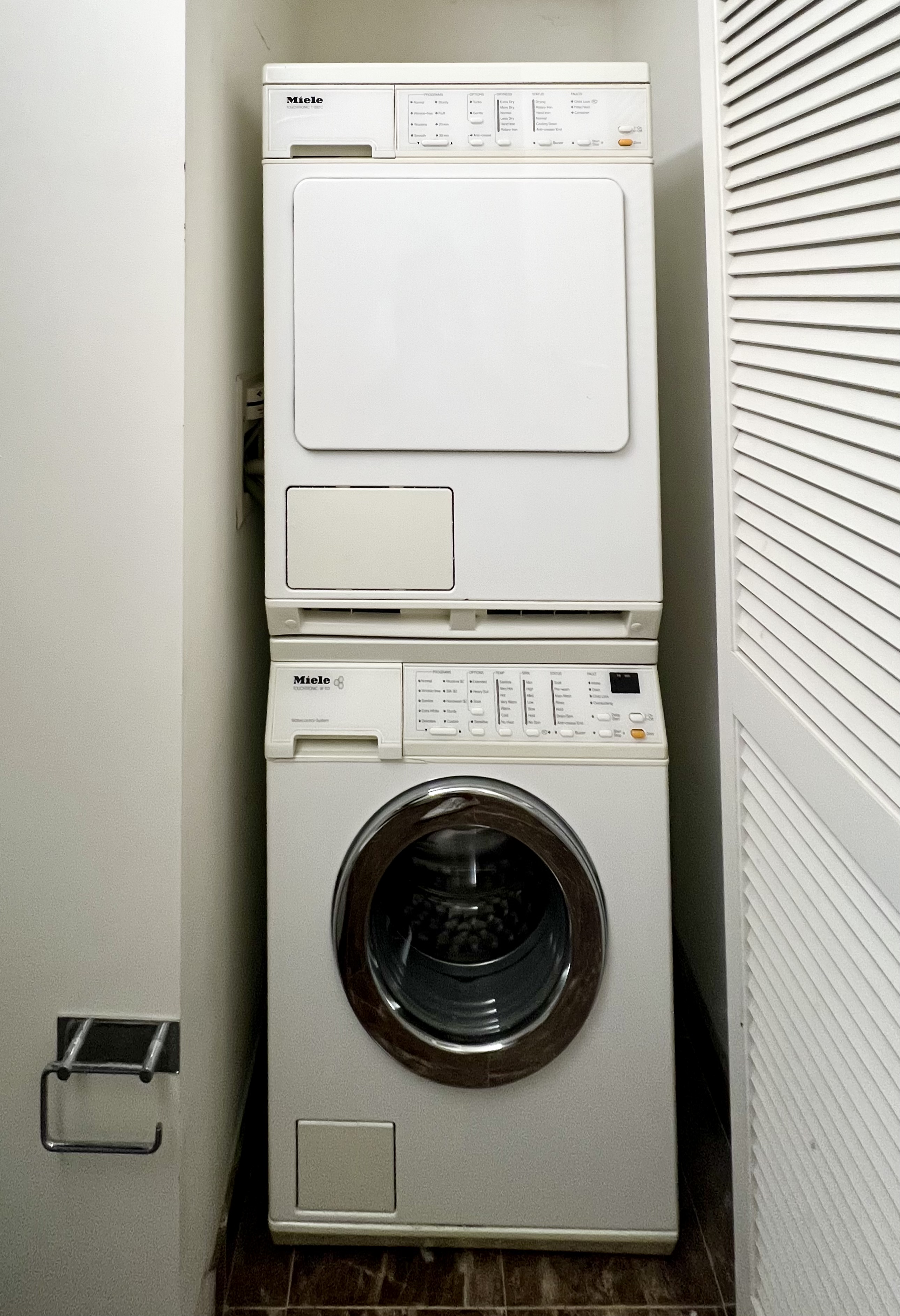 215-217 East 96th Street, Unit 25B Manhattan, NY 10128 - Photo 7 of 19 a close up view of a washer and dryer