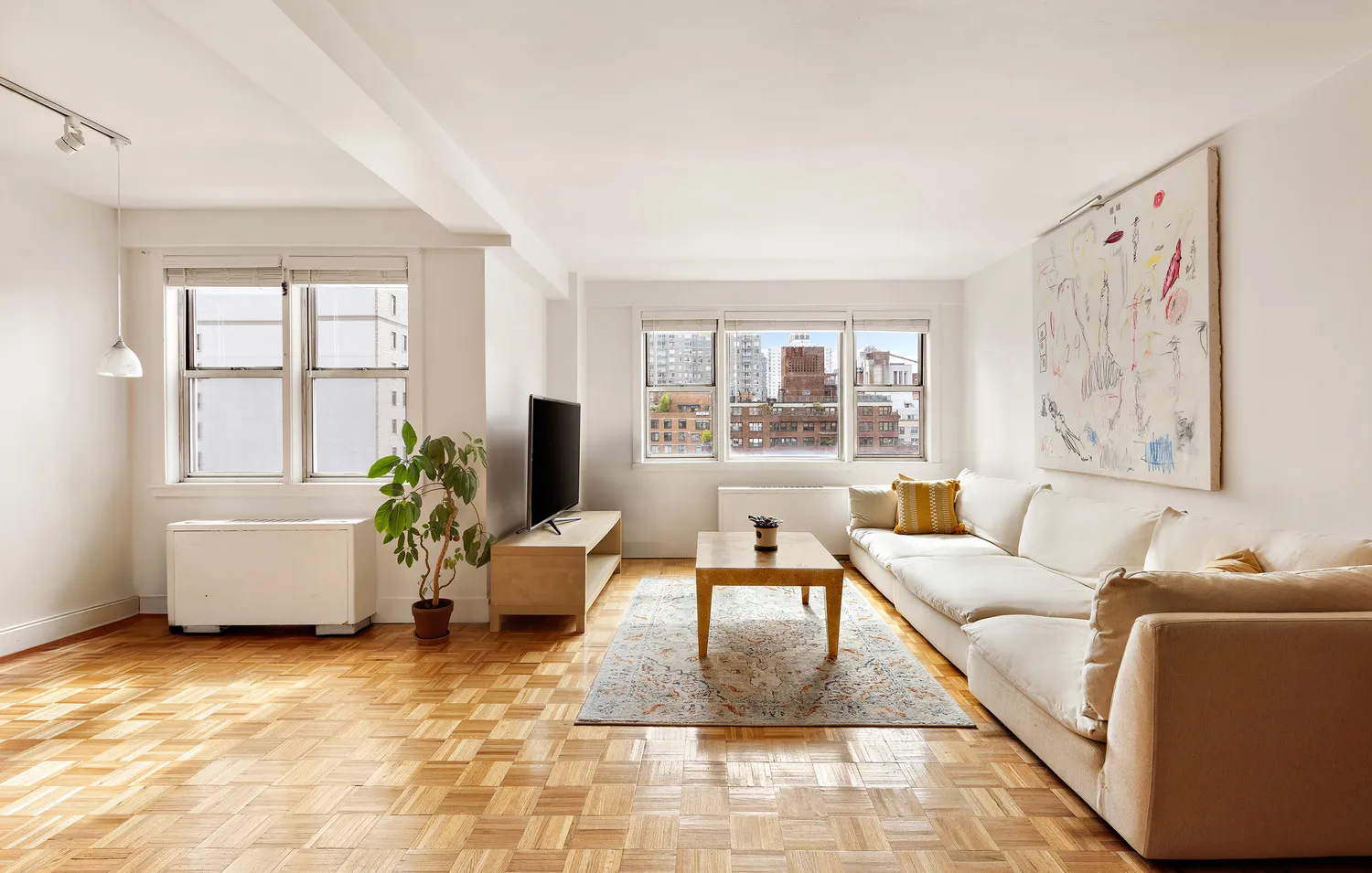a living room with furniture and a large window