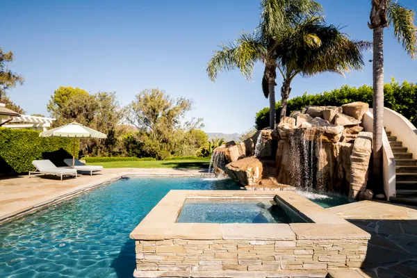 a outdoor space with lots of furniture and stainless steel appliances