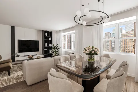 a living room with furniture a chandelier and a flat screen tv