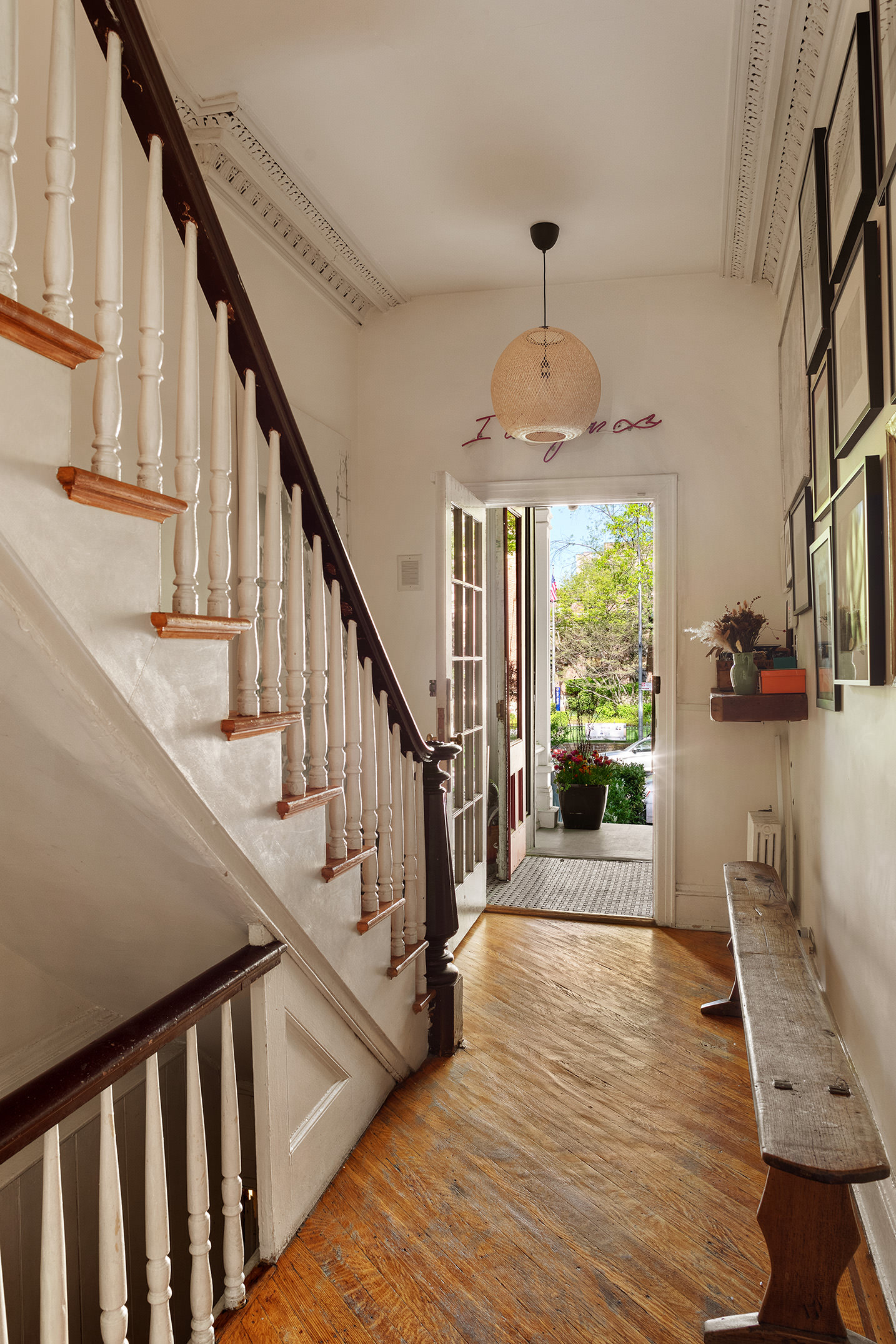264 Clinton Avenue Brooklyn, NY 11205 - Photo 3 of 21 a view of a hallway with wooden floor stairs