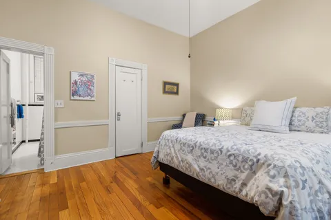 a bedroom with a bed and a cabinets