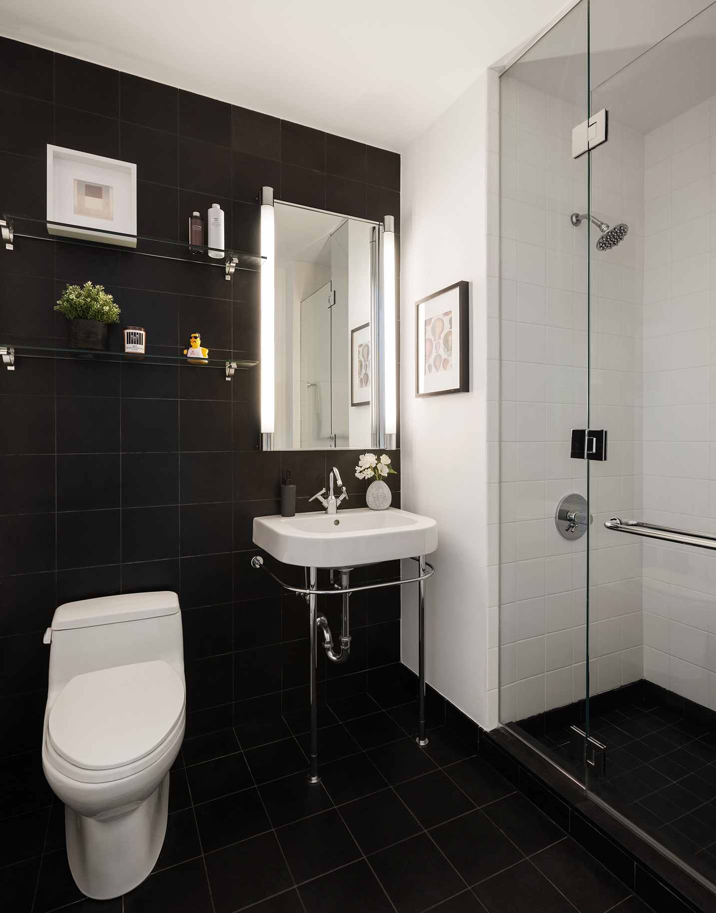 445 Lafayette Street, Unit 9C Manhattan, NY 10003 - Photo 8 of 10 a bathroom with a sink toilet and mirror