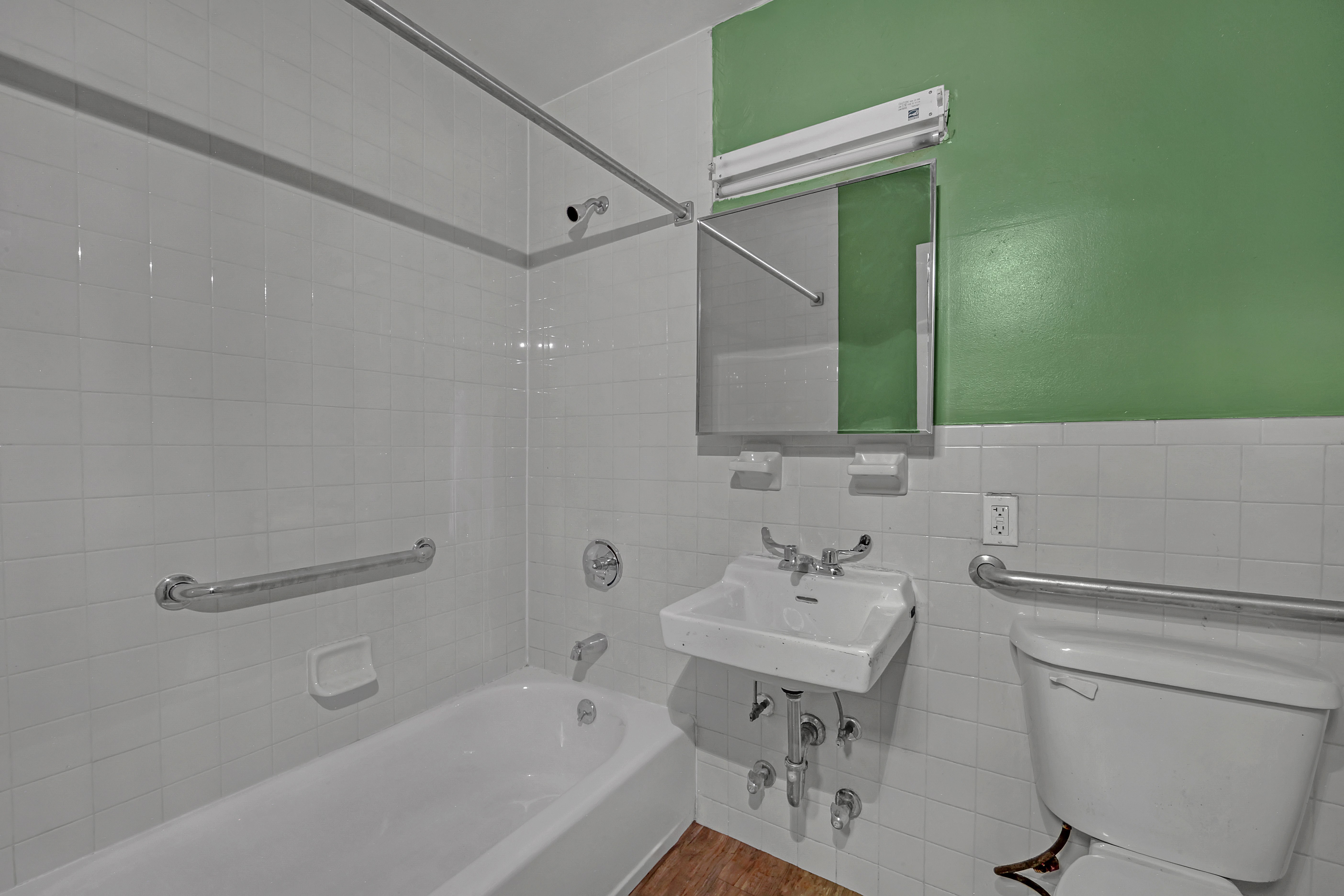 430 Lenox Avenue, Unit 1 Manhattan, NY 10037 - Photo 11 of 14 a bathroom with a sink toilet and shower