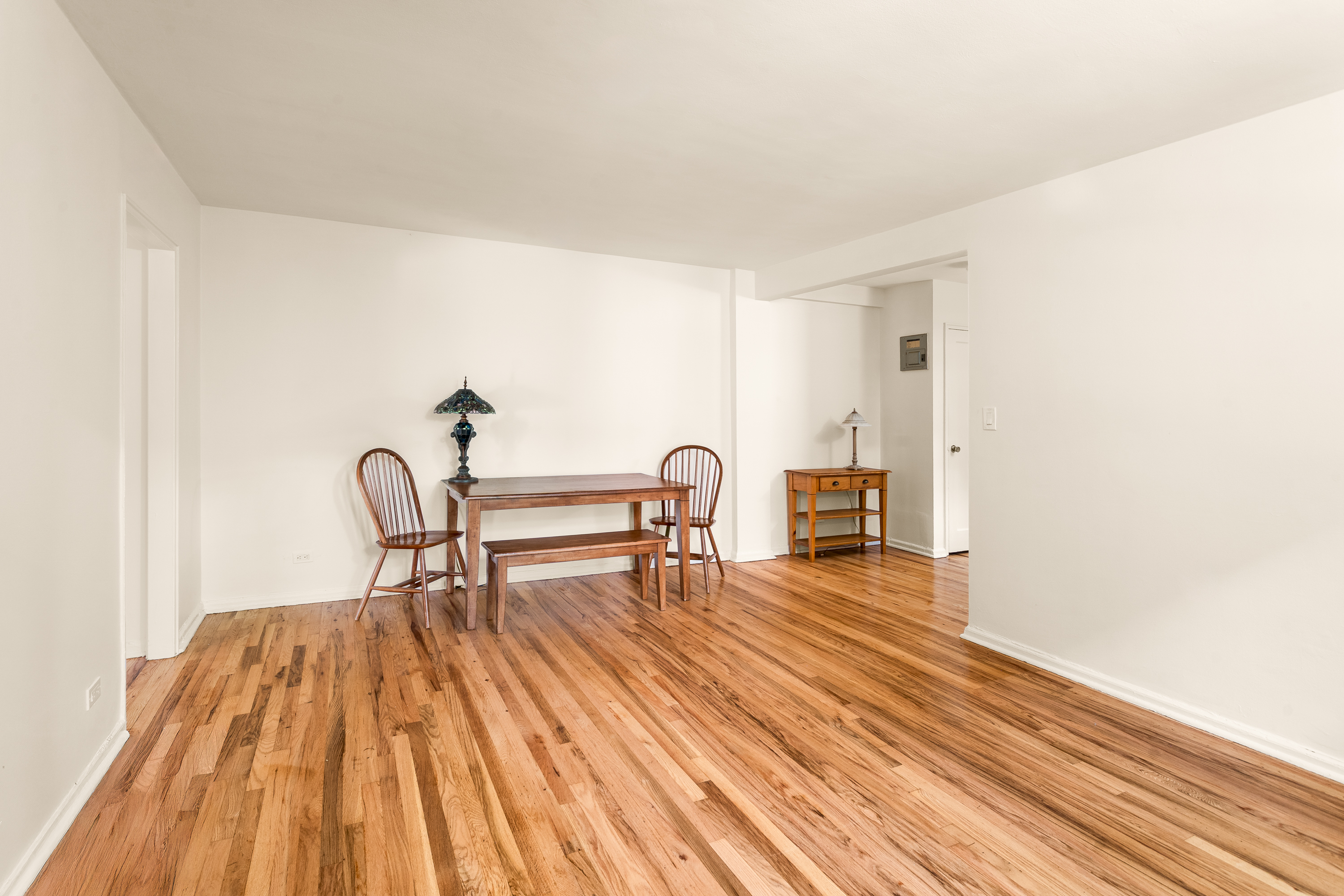 5610 Netherland Avenue, Unit 1G Bronx, NY 10471 - Photo 3 of 14 a view of dining room with furniture and wooden floor