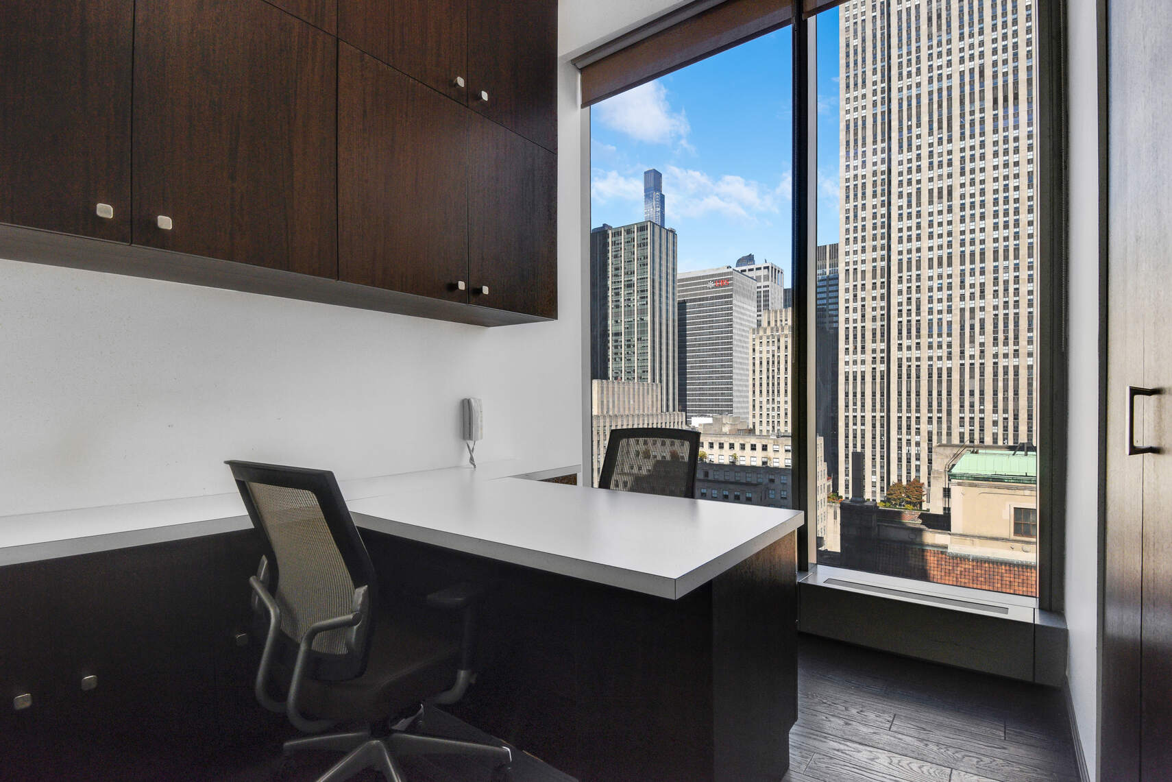 50 West 47th Street, Unit Undisclosed Manhattan, NY 10036 - Photo 13 of 27 a kitchen with a sink cabinets and wooden floor