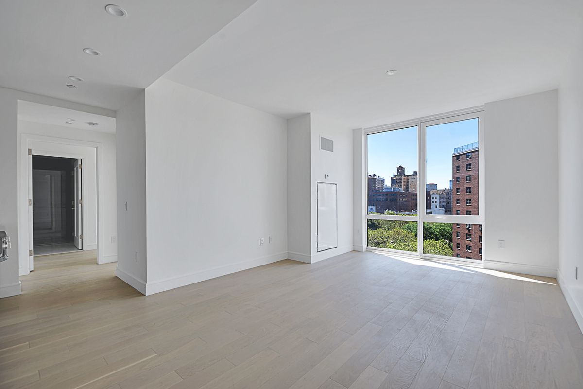 1399 Park Avenue, Unit 7B Manhattan, NY 10029 - Photo 4 of 14 a view of an empty room with a window and balcony