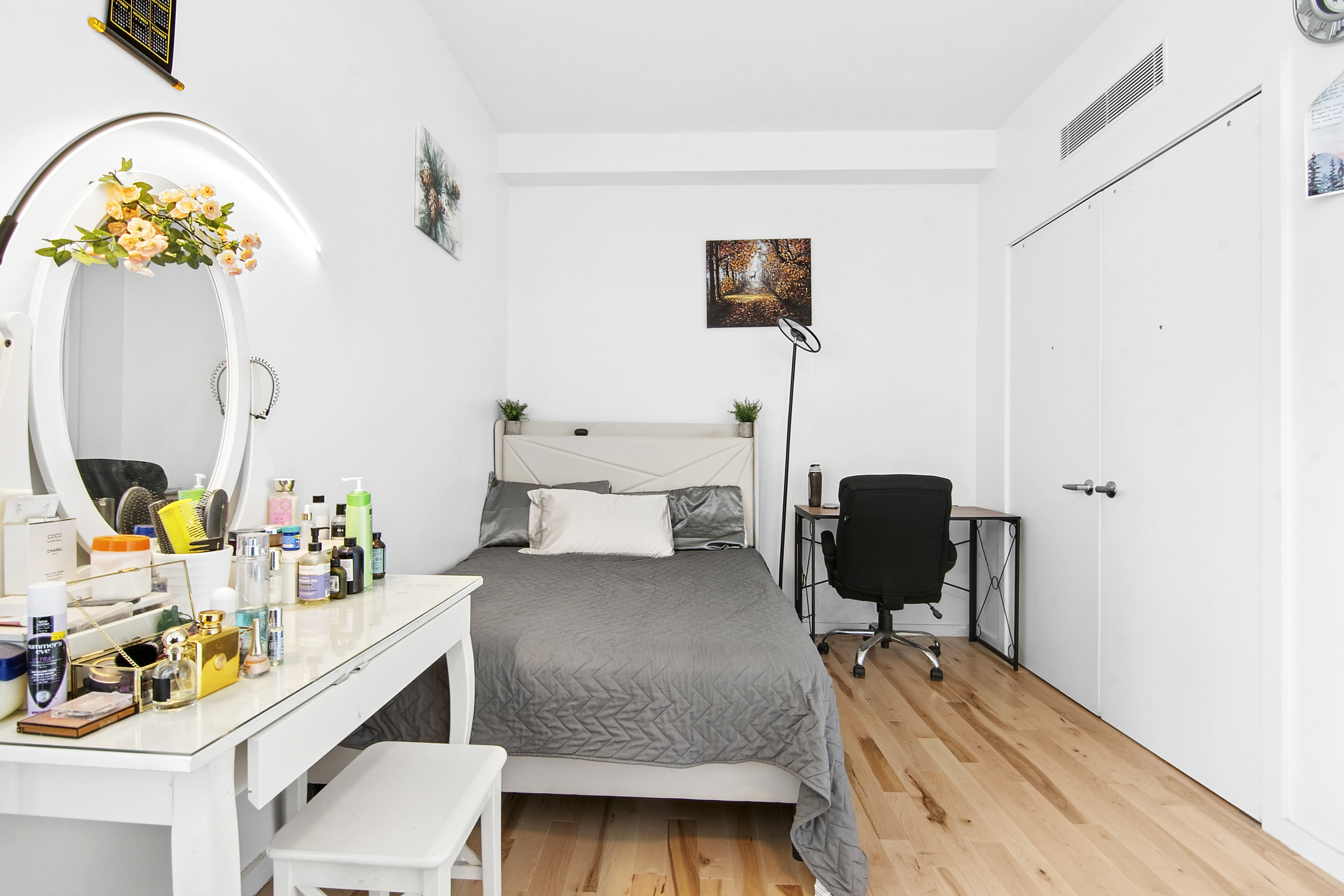 1064 Hancock Street, Unit 101 Brooklyn, NY 11221 - Photo 4 of 9 a bedroom with a bed and a chandelier