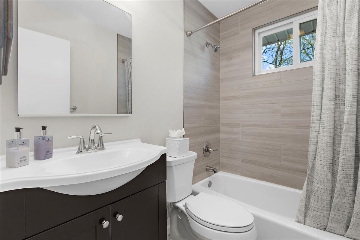 12712 Atherton Drive Silver Spring, MD 20906 - Photo 16 of 40 a bathroom with a sink a toilet and shower