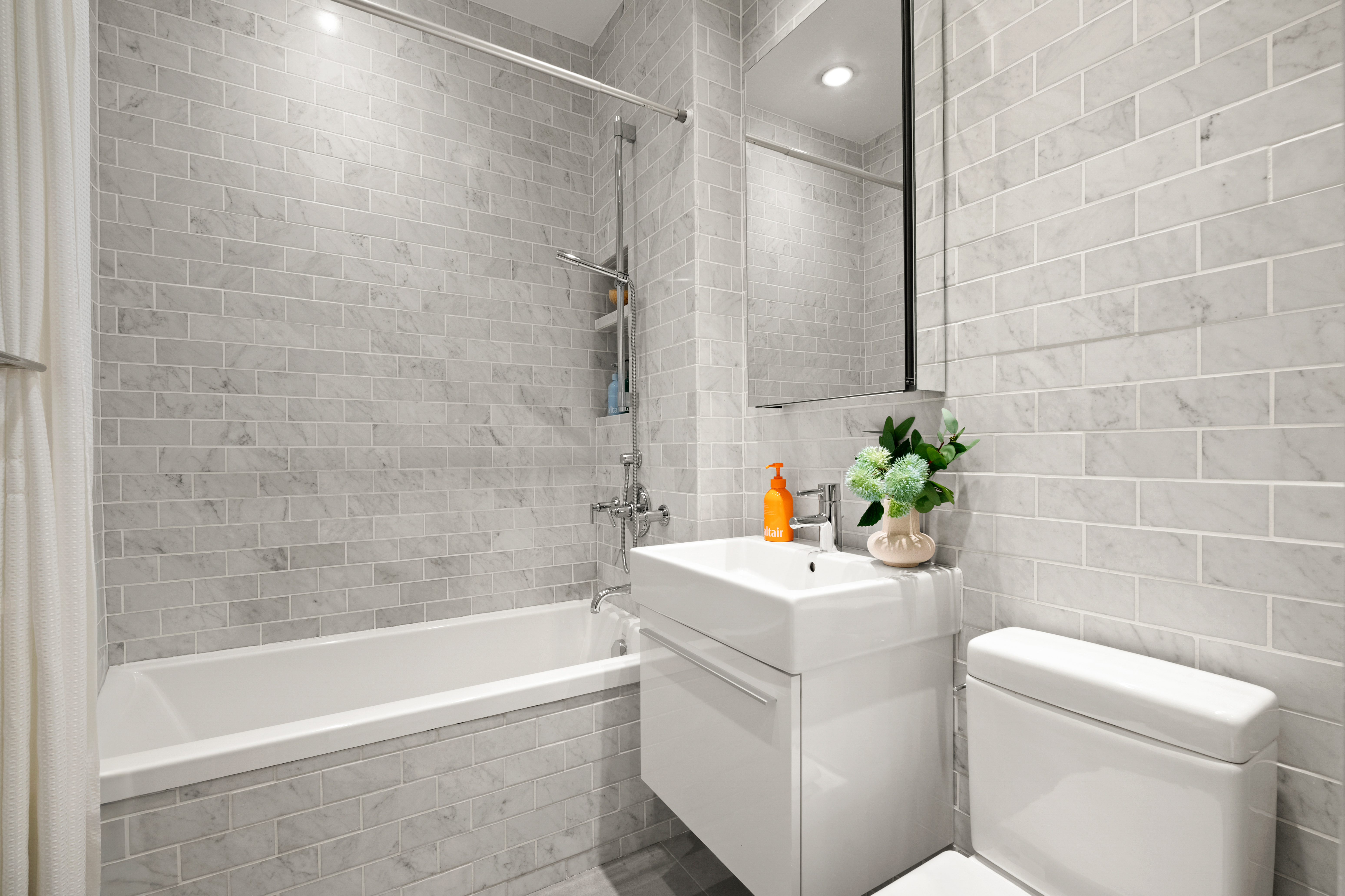 53 North Moore Street, Unit 2F East Manhattan, NY 10013 - Photo 10 of 12 a bathroom with a sink a toilet and bathtub