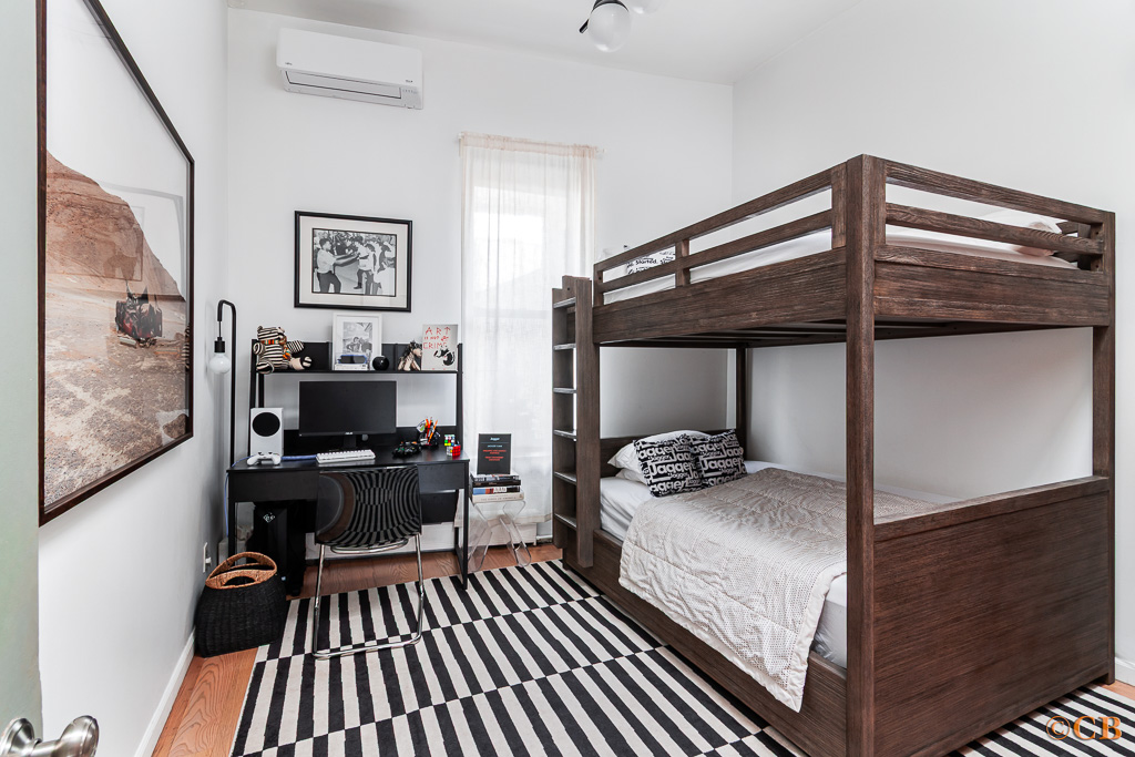 159 Carlton Avenue, Unit 4A Brooklyn, NY 11205 - Photo 5 of 9 a bedroom with furniture and wooden floor