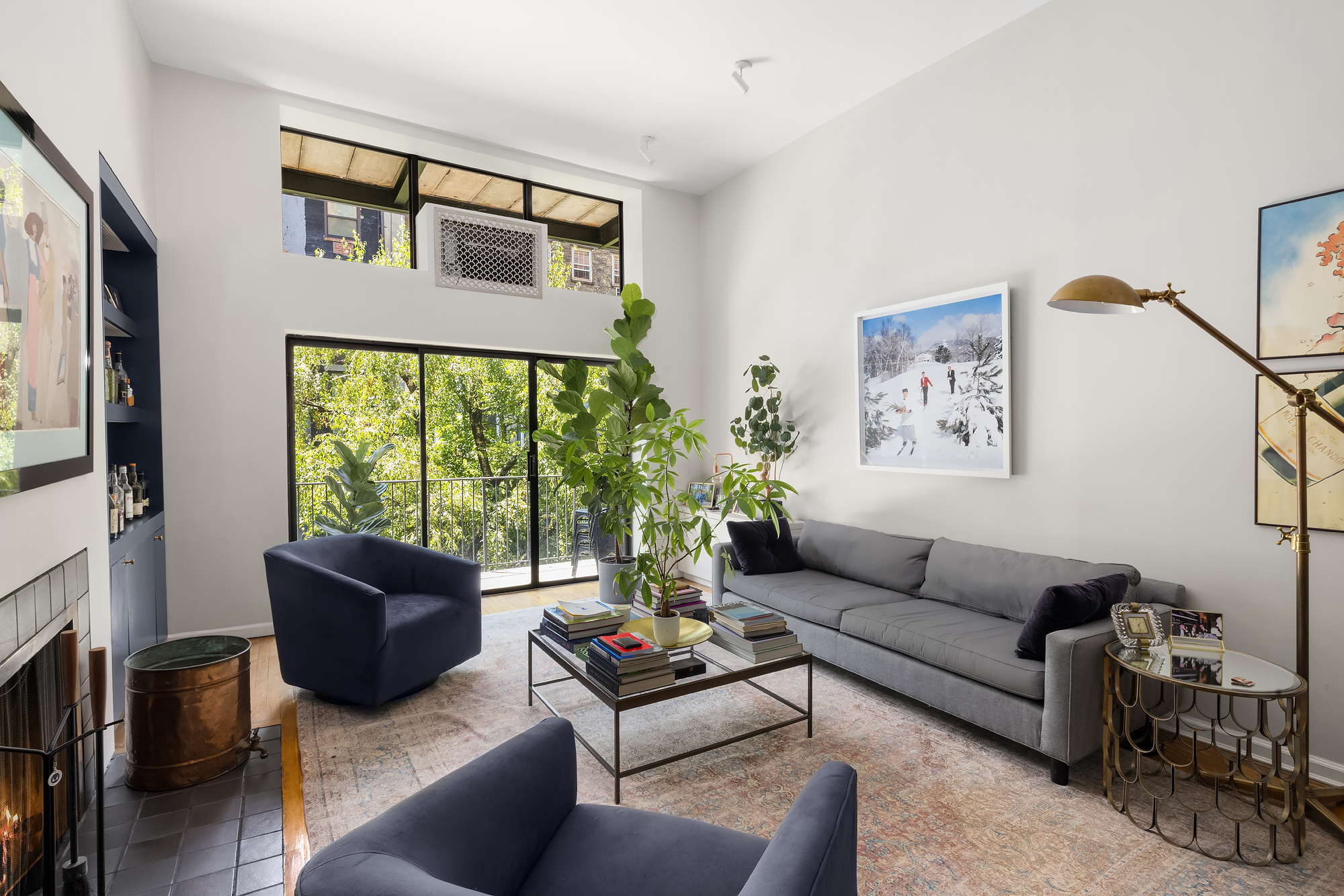 430 West 23rd Street, Unit C Manhattan, NY 10011 - Photo 3 of 16 a living room with furniture and a window
