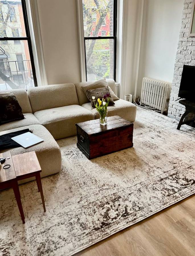 393 Clermont Avenue, Unit 3 Brooklyn, NY 11238 - Photo 3 of 10 a living room with furniture and a window